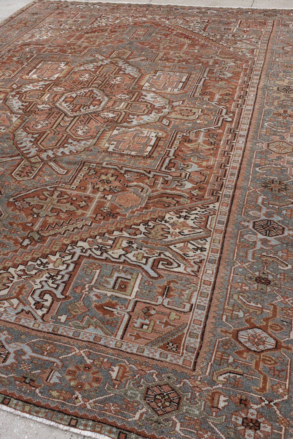 9' x 11' one-of-a-kind handmade vintage Heriz large size rug. Color palette: rust, blue-gray, ivory, coral, taupe, charcoal