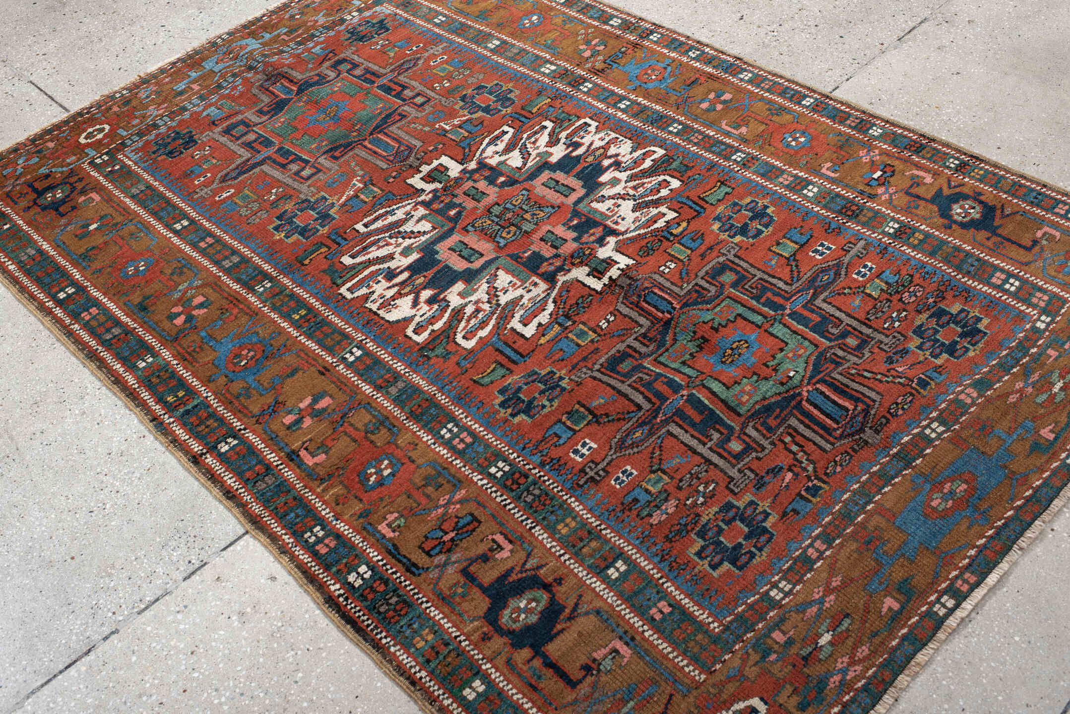 4' x 6' one-of-a-kind handmade vintage rug. Color palette: rust, teal, camel, navy, ivory, rose, brown, terracotta, beige