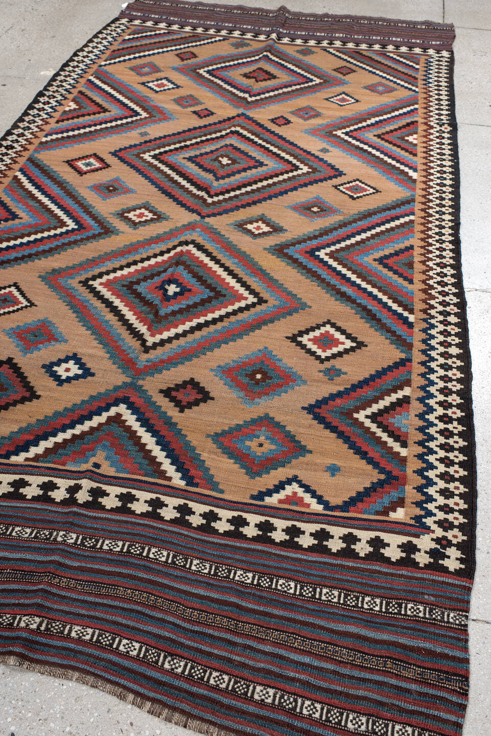 5' x 10' one-of-a-kind handmade antique Kilim runner rug. Color palette: camel, indigo, ivory, rust, turquoise, charcoal