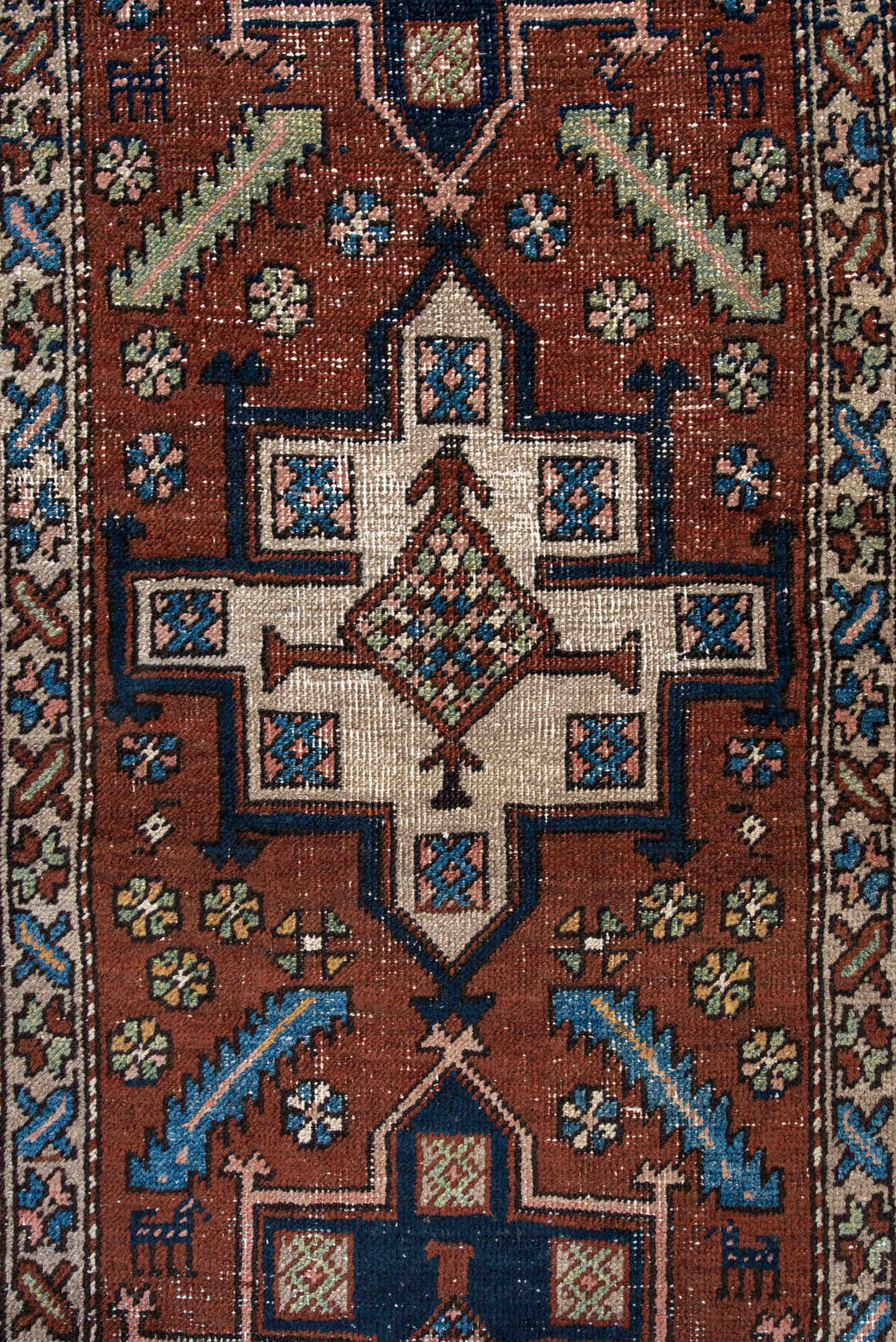 3' x 5' one-of-a-kind handmade antique Heriz small size rug. Color palette: rust, navy, ivory, sky_blue, brown, sage, camel