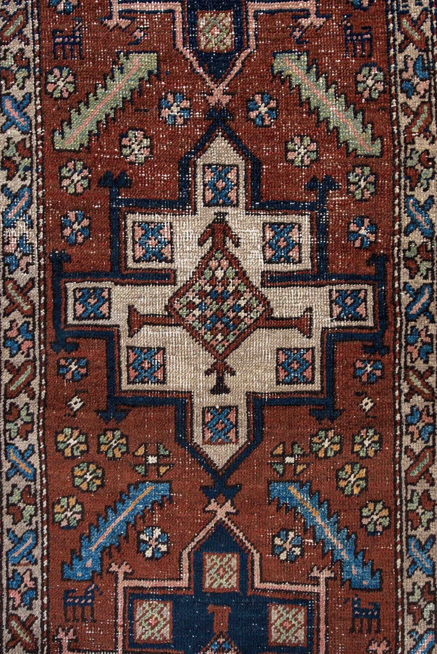 3' x 5' one-of-a-kind handmade antique Heriz small size rug. Color palette: rust, navy, ivory, sky_blue, brown, sage, camel