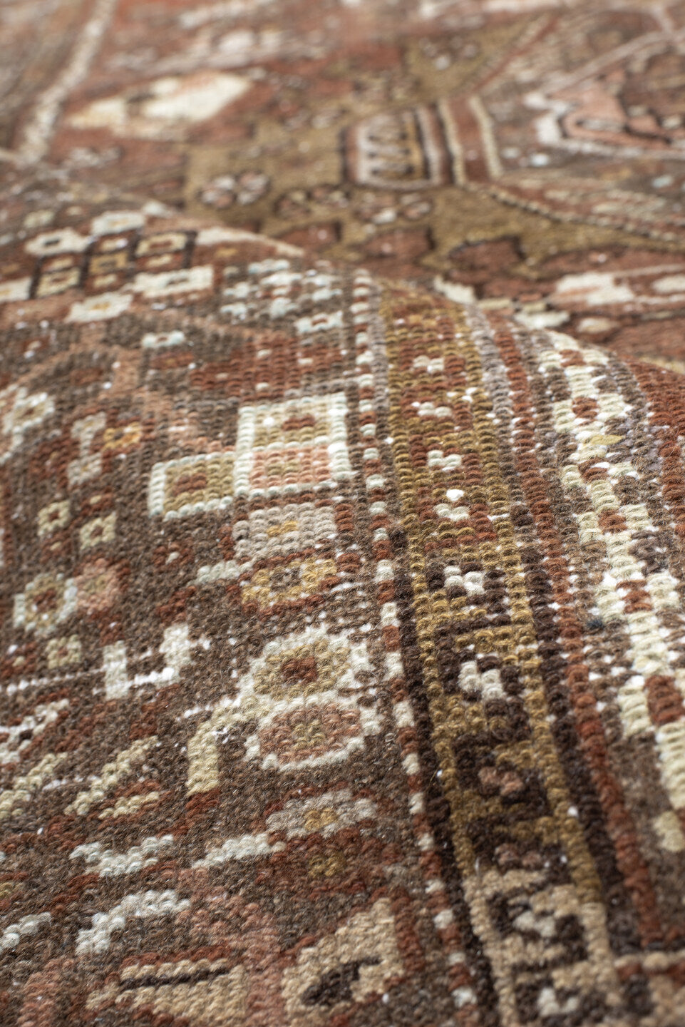 4' x 5' one-of-a-kind handmade antique Karaje small size rug. Color palette: brown, terra cotta, ivory, taupe, camel, rust