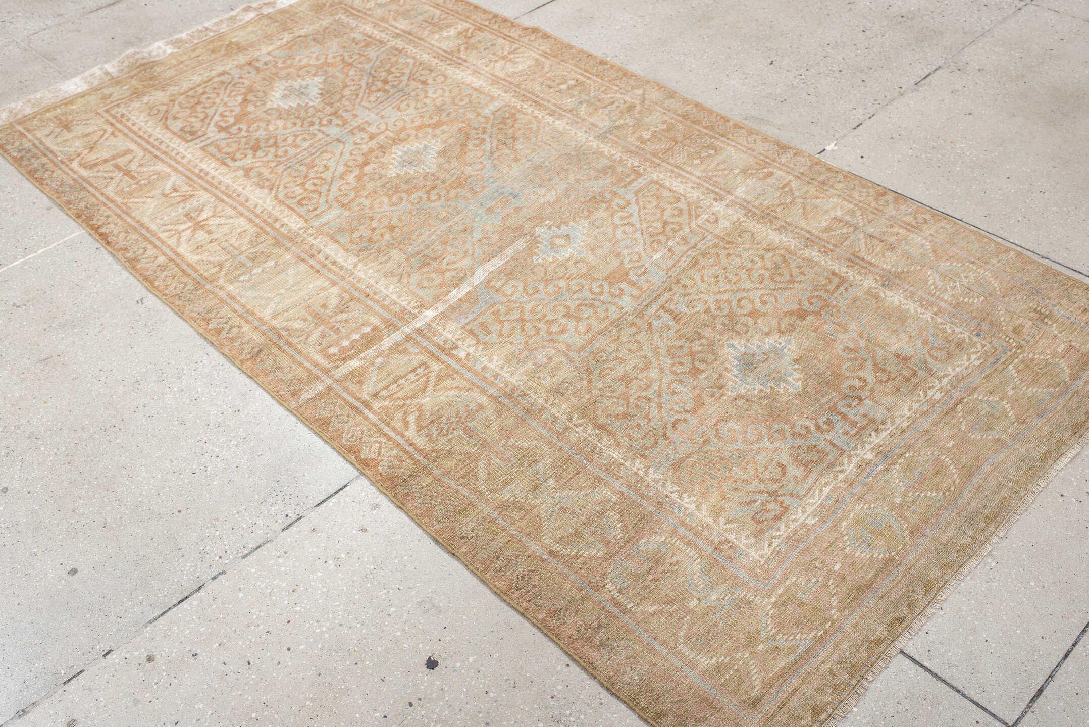 4' x 7' one-of-a-kind handmade vintage Belouch rug. Color palette: camel, taupe, ivory, pale aqua, blush, sand, light gray