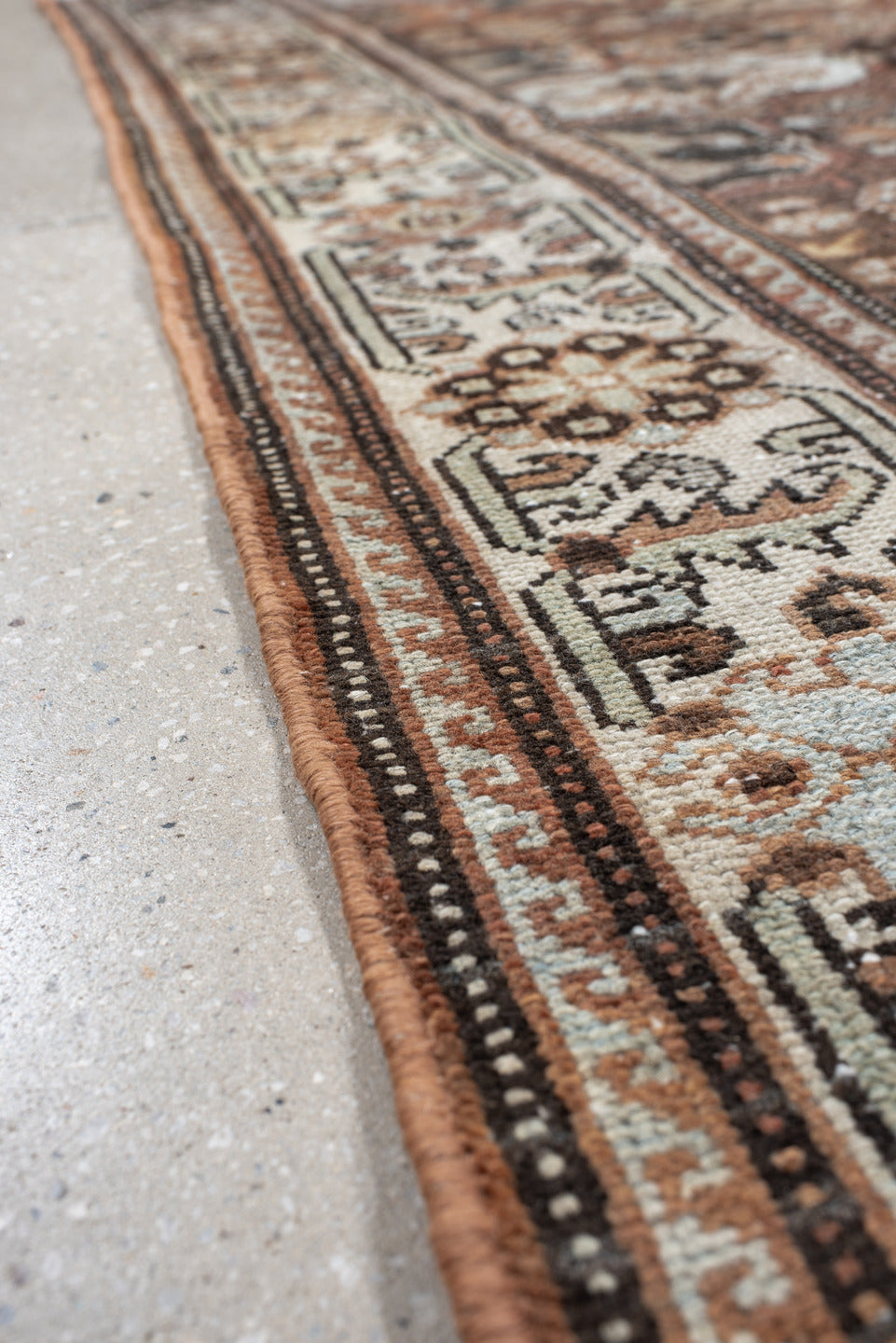 4' x 7' one-of-a-kind handmade vintage Baktiary rug. Color palette: black, brown, gray, light gray, off-white, pink, red