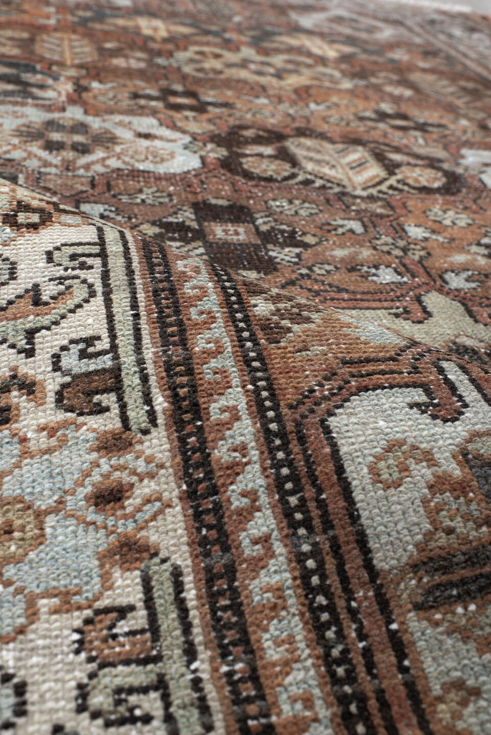 4' x 7' one-of-a-kind handmade vintage Baktiary rug. Color palette: rust, ivory, charcoal, soft blue, brown, camel, burgundy
