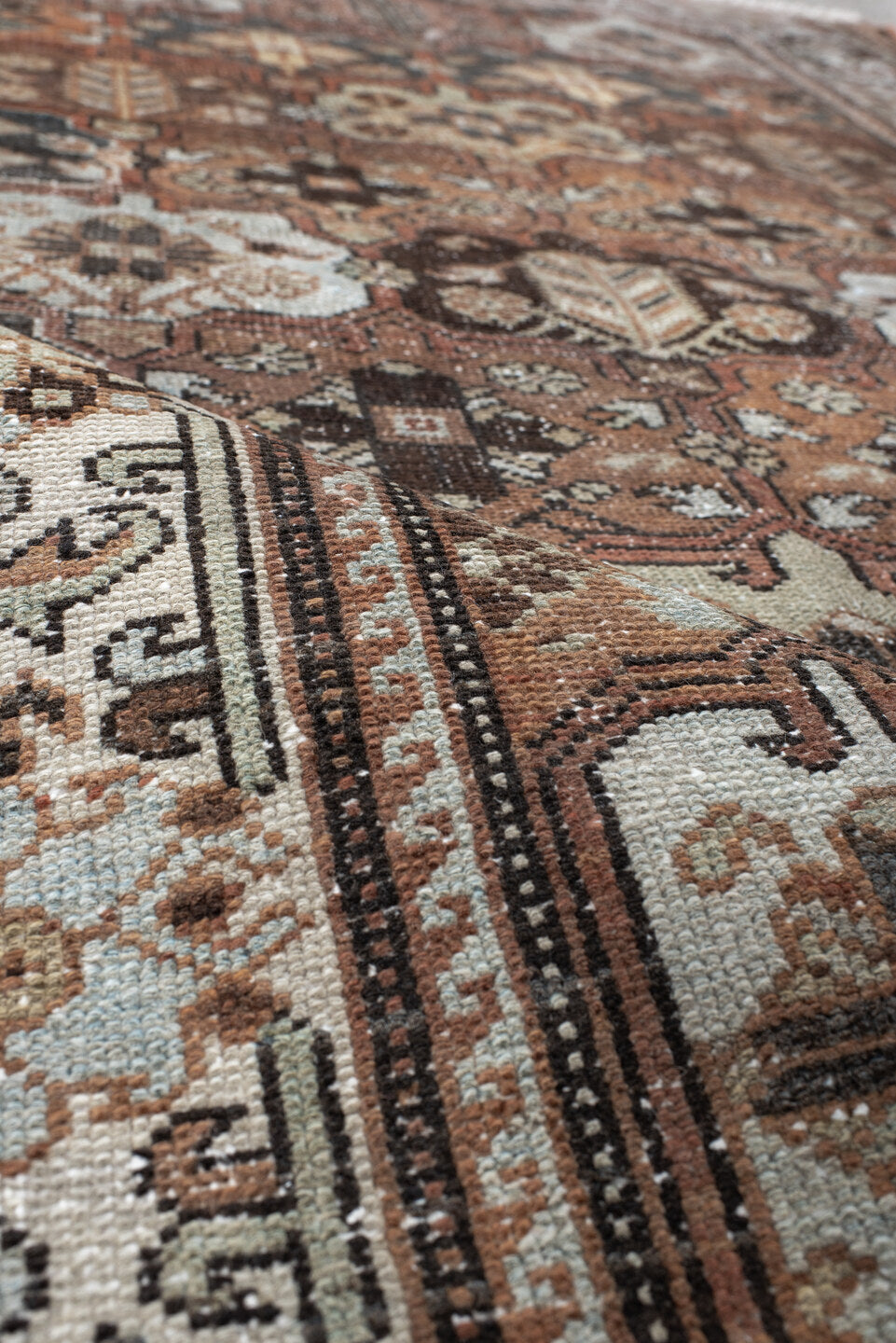 4' x 7' one-of-a-kind handmade vintage Baktiary rug. Color palette: rust, ivory, charcoal, soft blue, brown, camel, burgundy