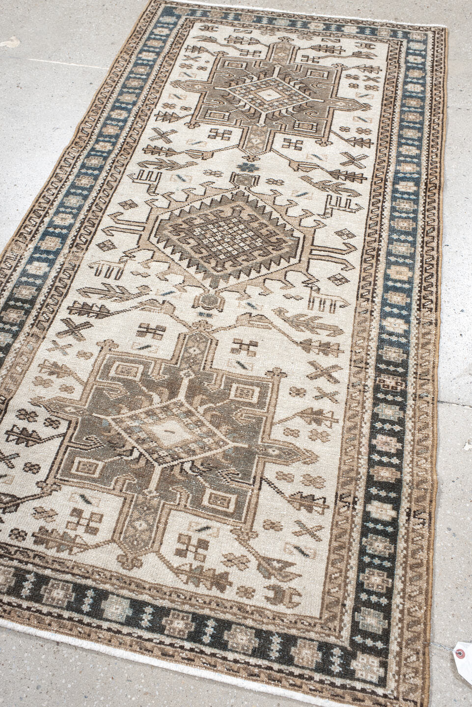3' x 6' one-of-a-kind handmade vintage Karaje runner rug. Color palette: ivory, taupe, navy, brown, camel, charcoal, beige