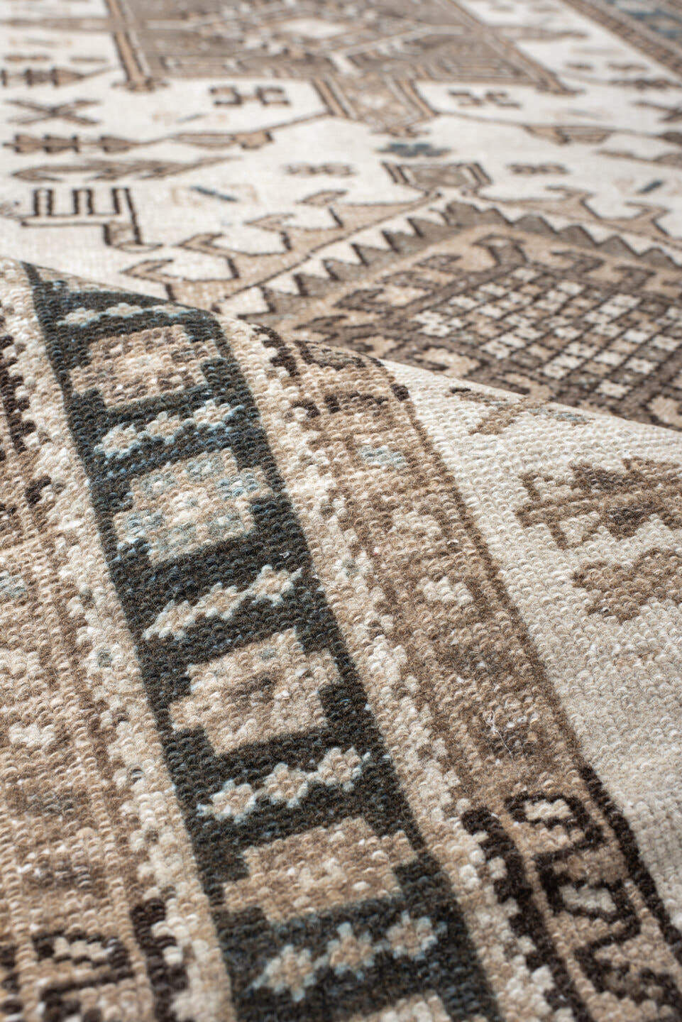 3' x 6' one-of-a-kind handmade vintage Karaje runner rug. Color palette: ivory, taupe, navy, brown, camel, charcoal, beige
