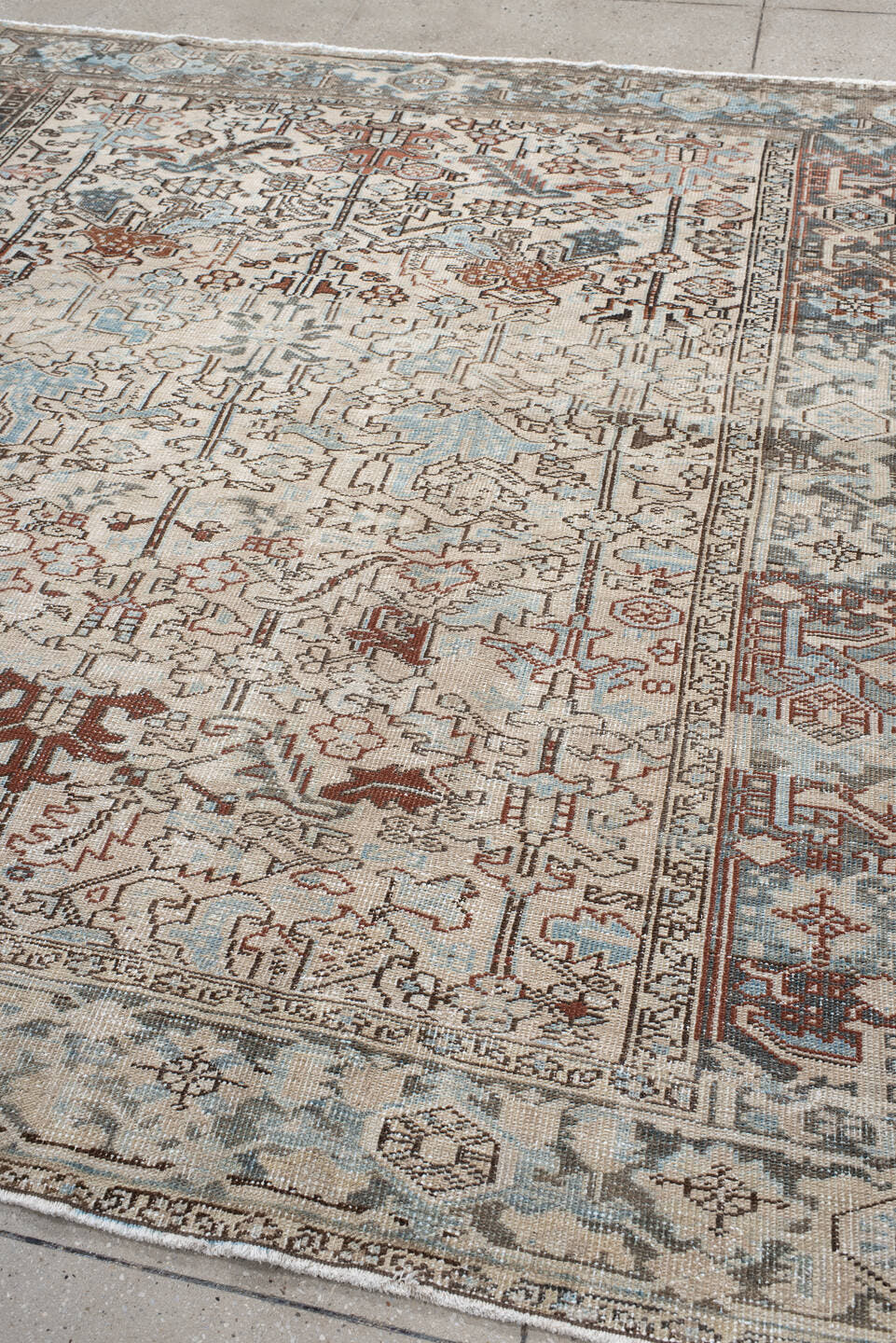 7' x 8' one-of-a-kind handmade antique Heriz rug. Color palette: ivory, sky blue, slate, taupe, rust, charcoal, camel