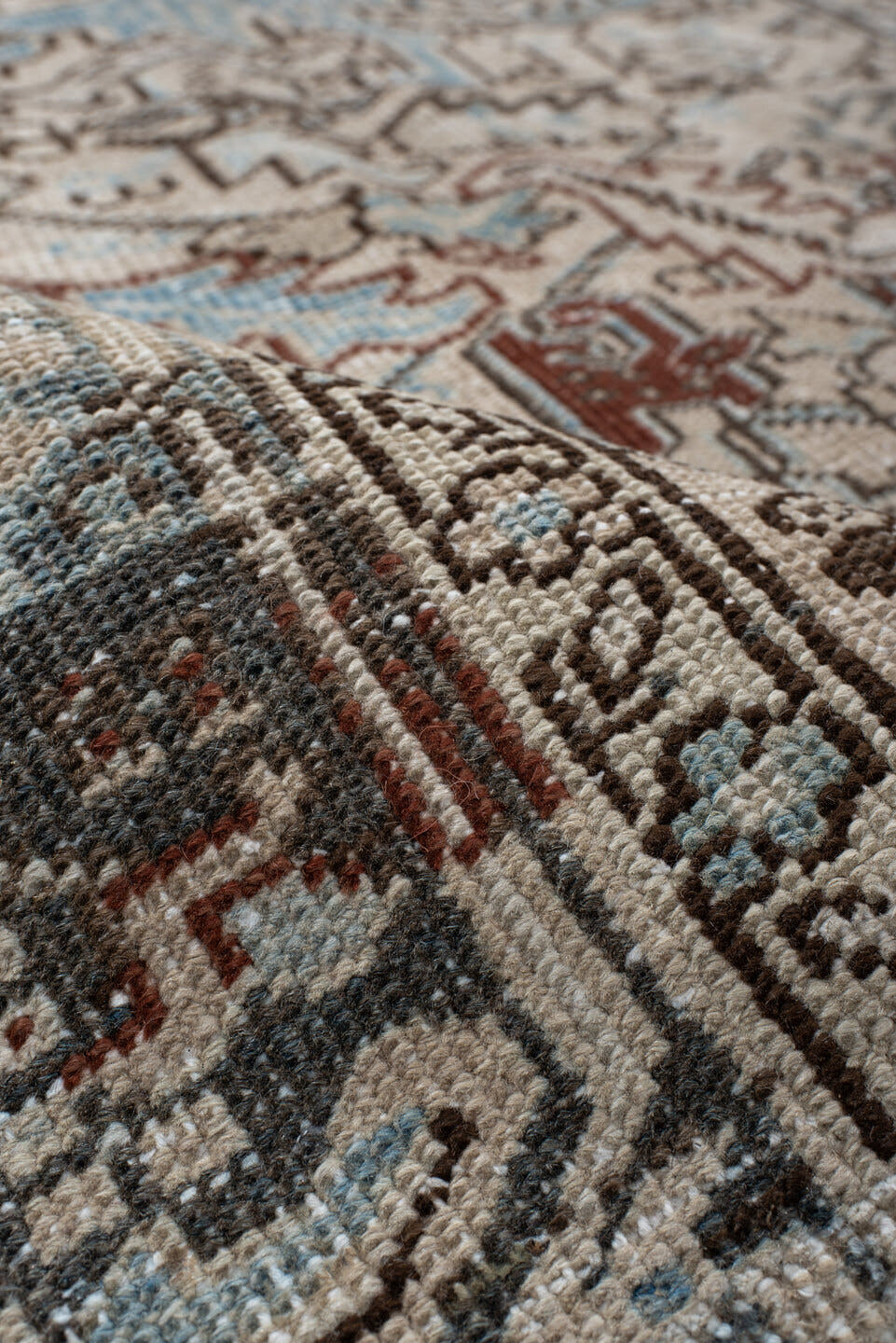 7' x 8' one-of-a-kind handmade antique Heriz rug. Color palette: ivory, sky blue, slate, taupe, rust, charcoal, camel