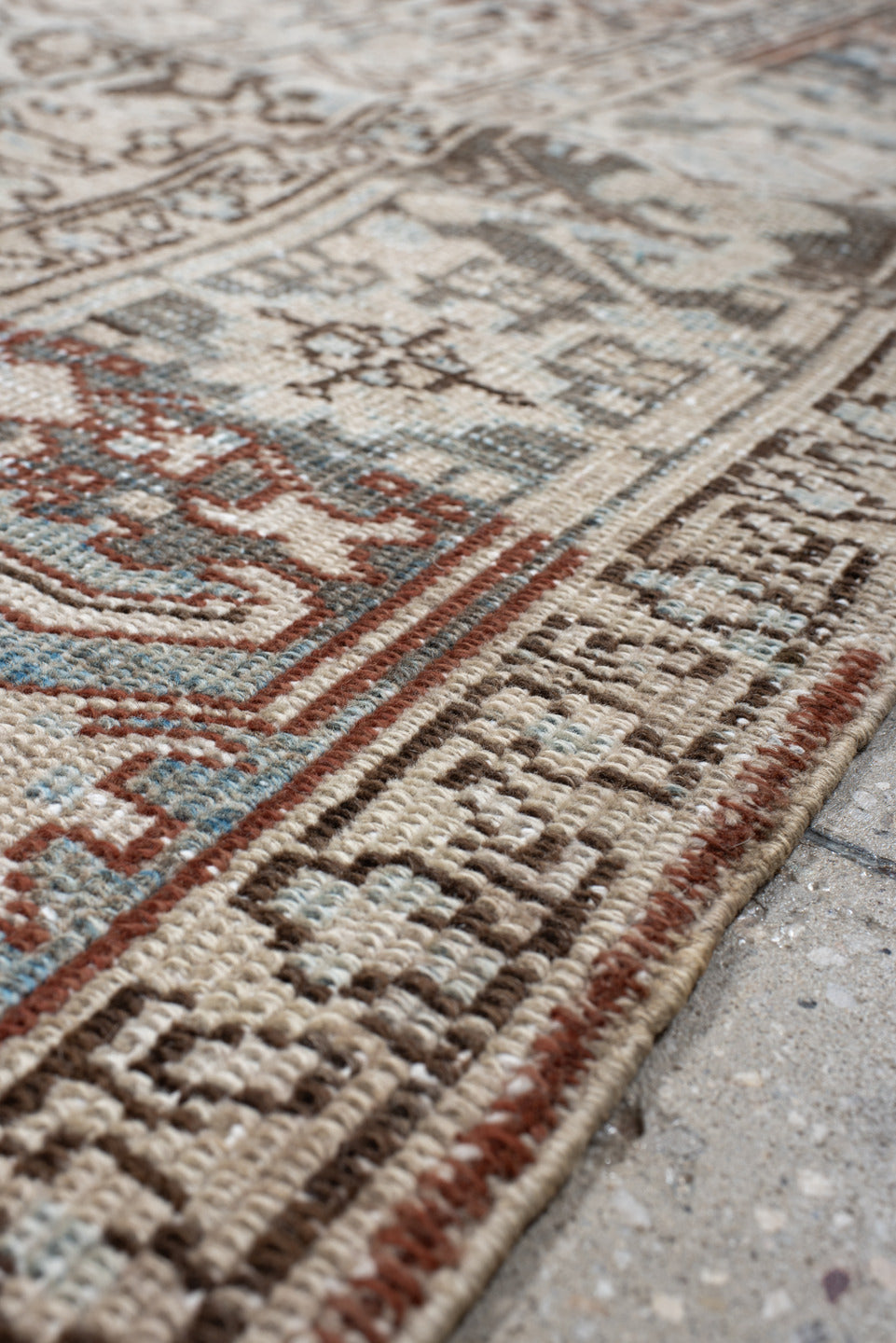 7' x 8' one-of-a-kind handmade antique Heriz rug. Color palette: ivory, sky blue, slate, taupe, rust, charcoal, camel
