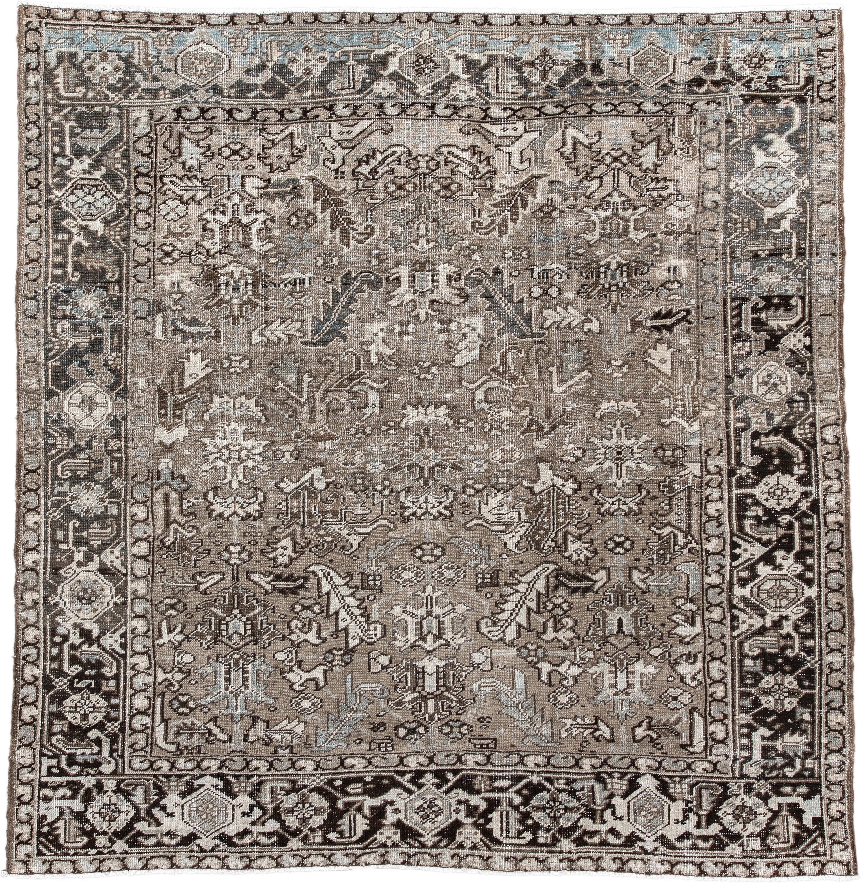 7' x 7' one-of-a-kind handmade antique Heriz rug. Color palette: taupe, ivory, charcoal, brown, slate, pale blue, beige