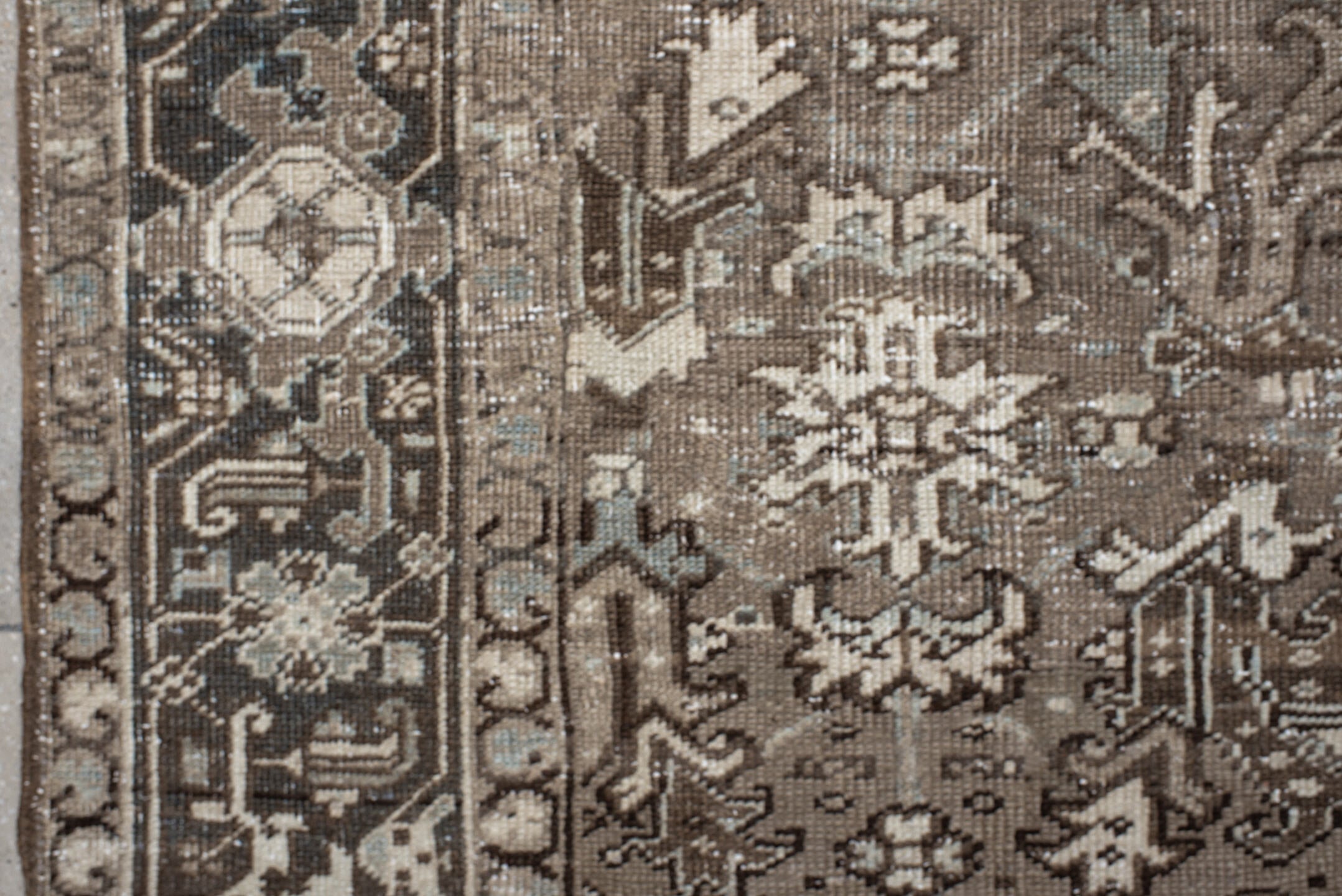 7' x 7' one-of-a-kind handmade antique Heriz rug. Color palette: taupe, ivory, charcoal, brown, slate, pale blue, beige