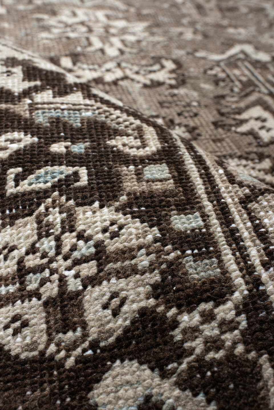 7' x 7' one-of-a-kind handmade antique Heriz rug. Color palette: taupe, ivory, charcoal, brown, slate, pale blue, beige