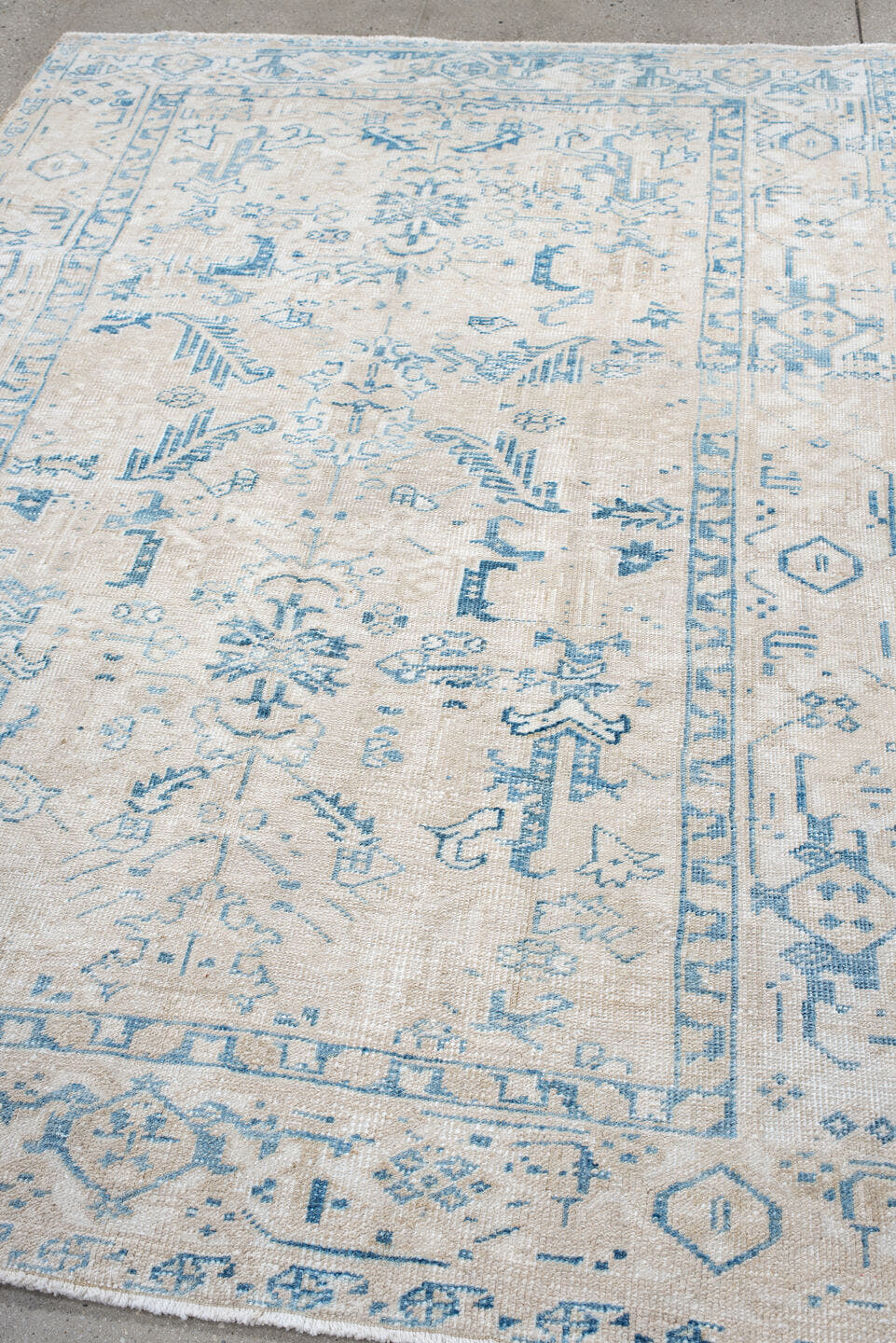 5' x 8' one-of-a-kind handmade antique Heriz medium size rug. Color palette: ivory, sky blue, ice blue, cream, beige
