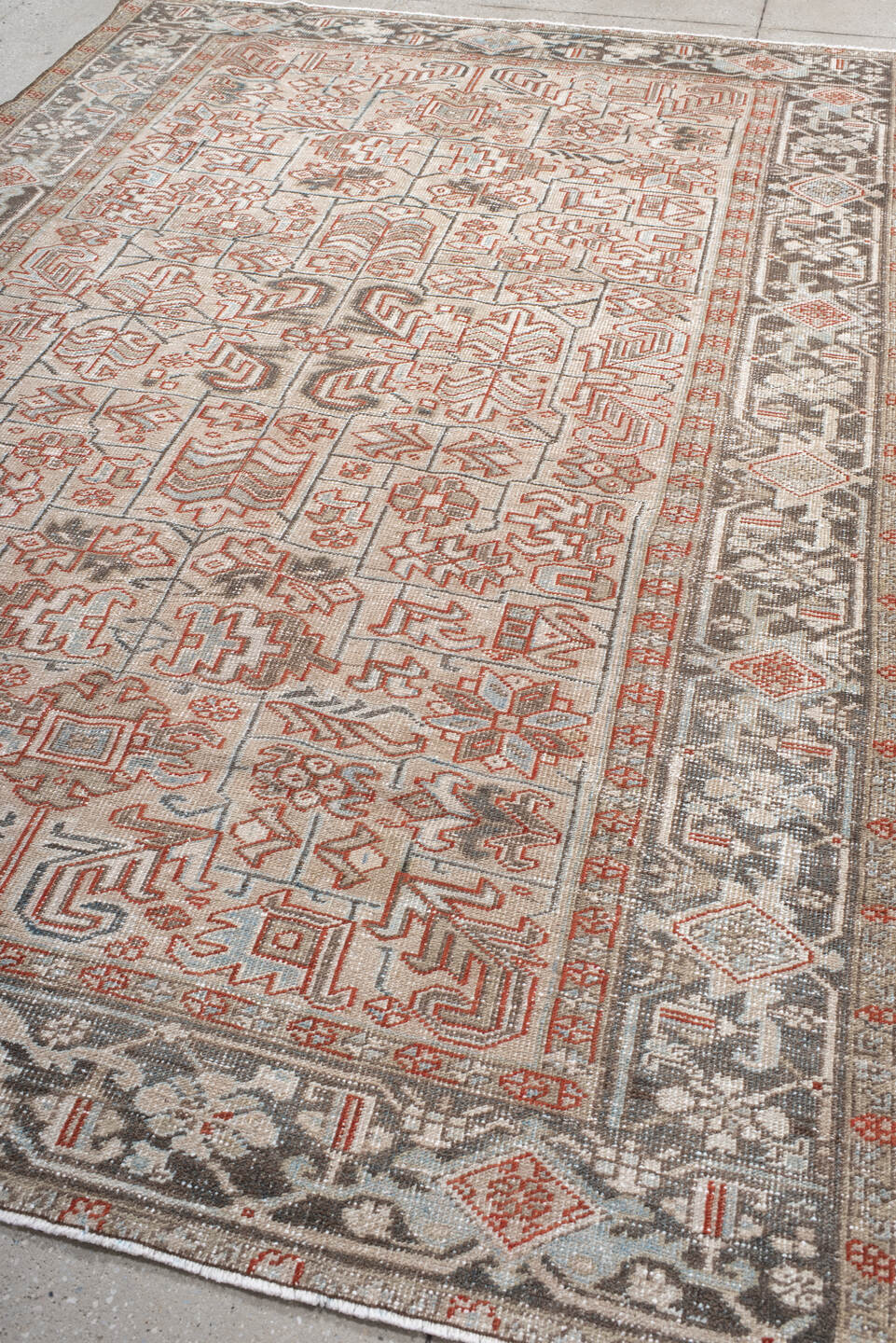 6' x 9' one-of-a-kind handmade antique Heriz medium size rug. Color palette: ivory, charcoal, rust, sky_blue, taupe, gray
