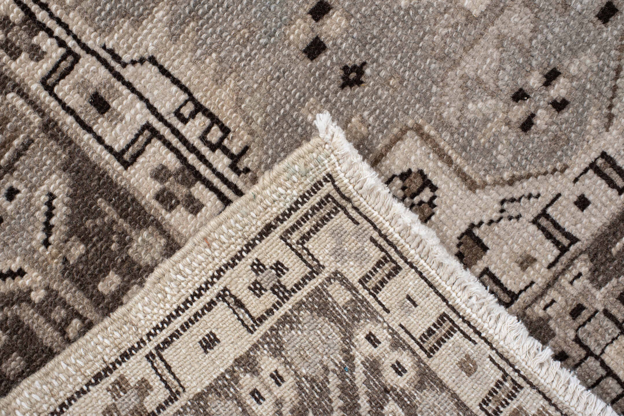 5' x 6' one-of-a-kind handmade vintage Karaje rug. Color palette: black, brown, gray, light gray, off-white, pink