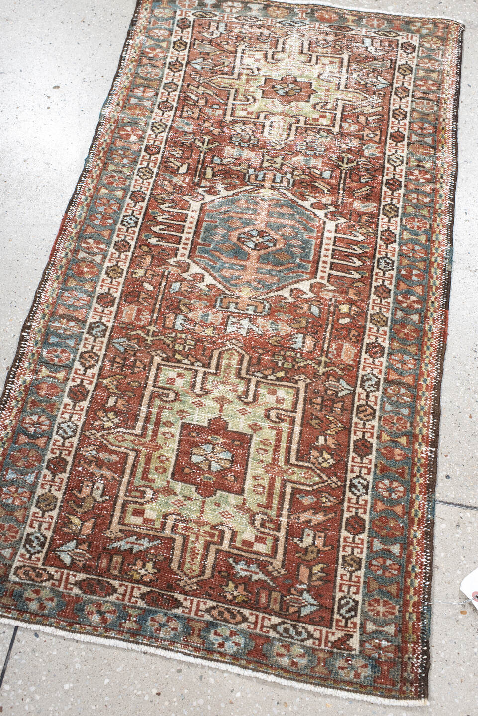 2' x 3' one-of-a-kind handmade vintage Karaje small size rug. Color palette: rust, ivory, blue, brown, sage, charcoal