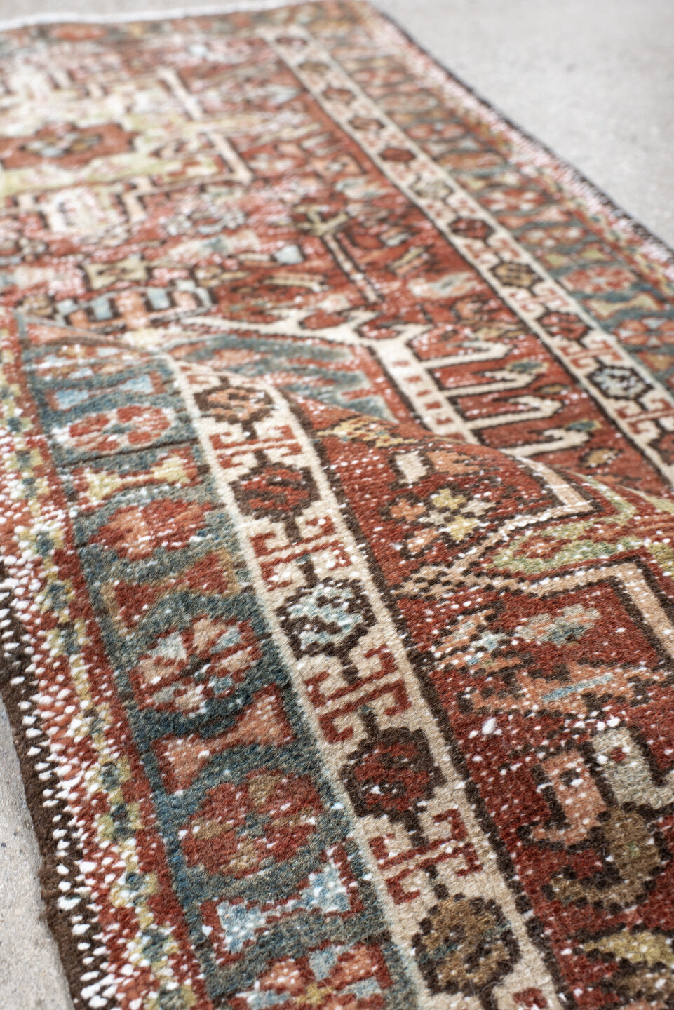 2' x 3' one-of-a-kind handmade vintage Karaje small size rug. Color palette: rust, ivory, blue, brown, sage, charcoal