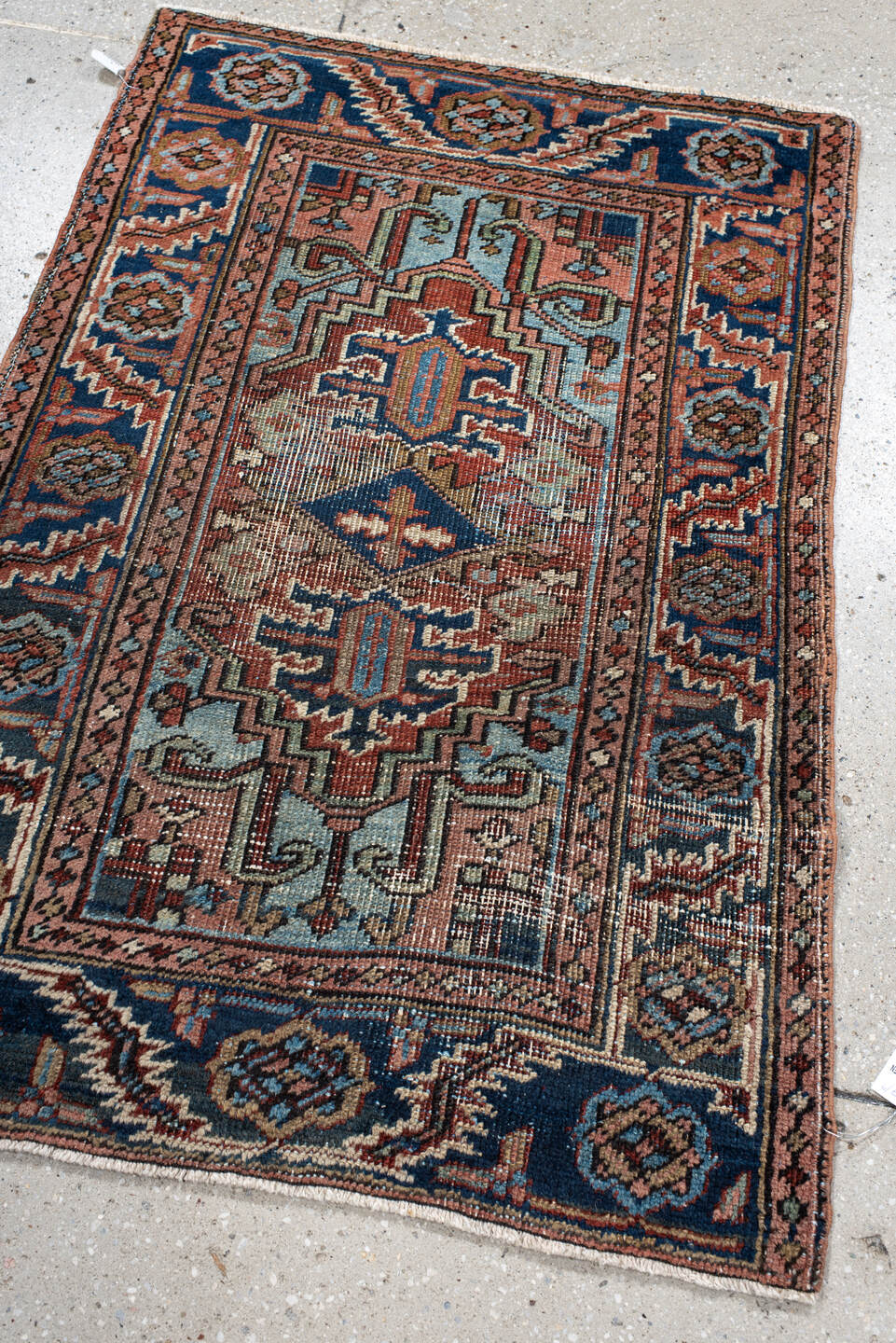 2' x 3' one-of-a-kind handmade antique Heriz small size rug. Color palette: navy, ivory, rust, sky_blue, camel, rose