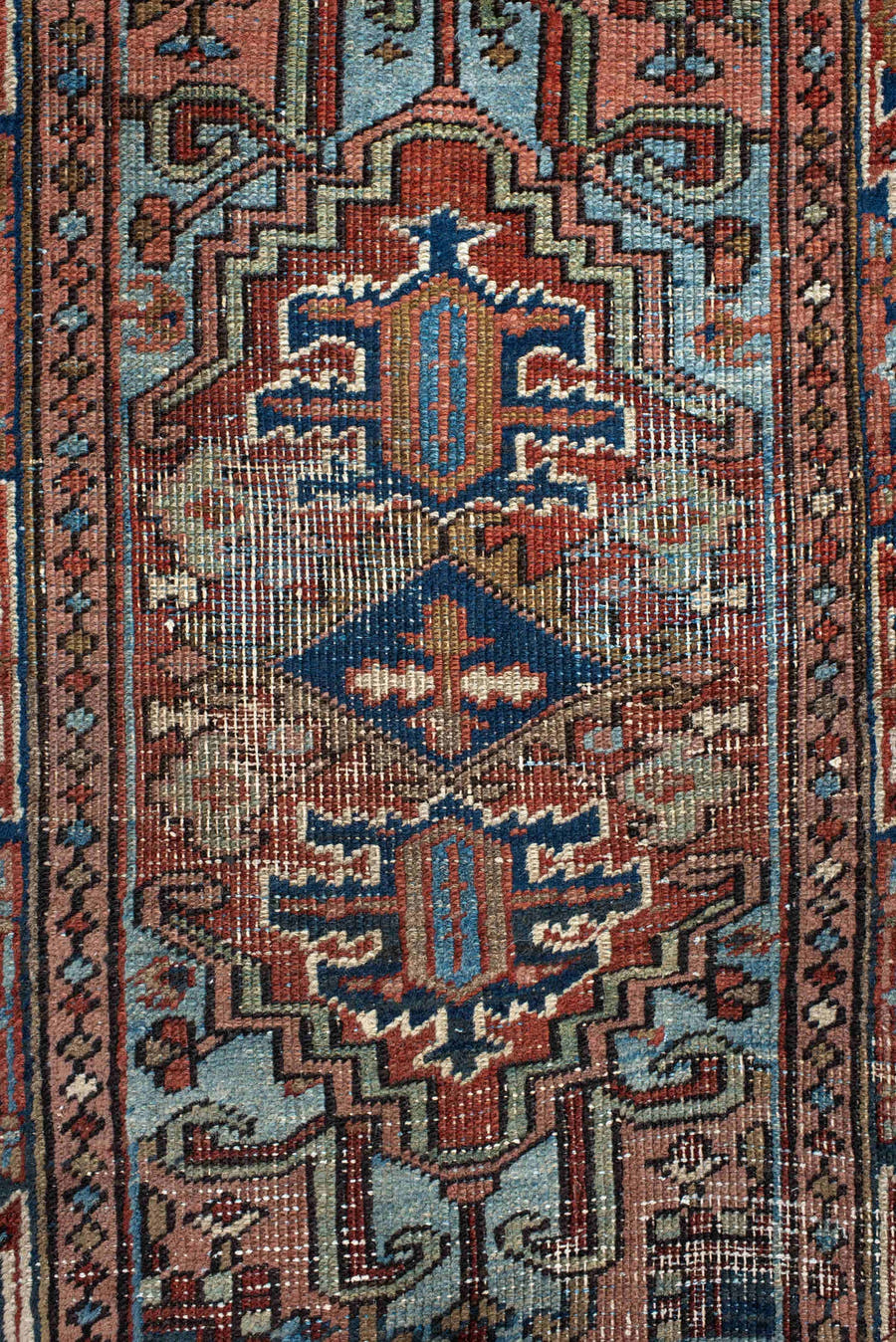 2' x 3' one-of-a-kind handmade antique Heriz small size rug. Color palette: navy, ivory, rust, sky_blue, camel, rose