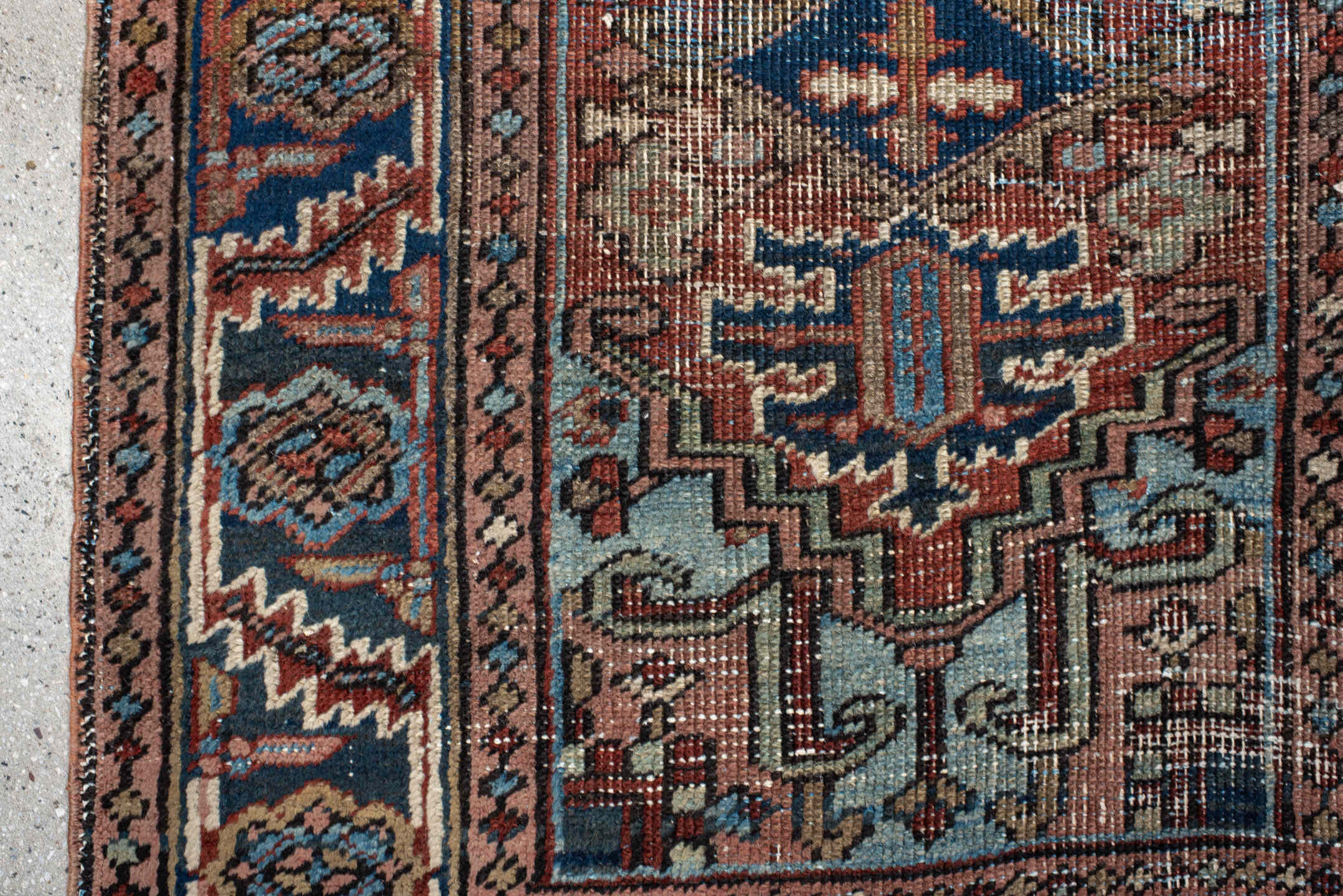 2' x 3' one-of-a-kind handmade antique Heriz small size rug. Color palette: navy, ivory, rust, sky_blue, camel, rose