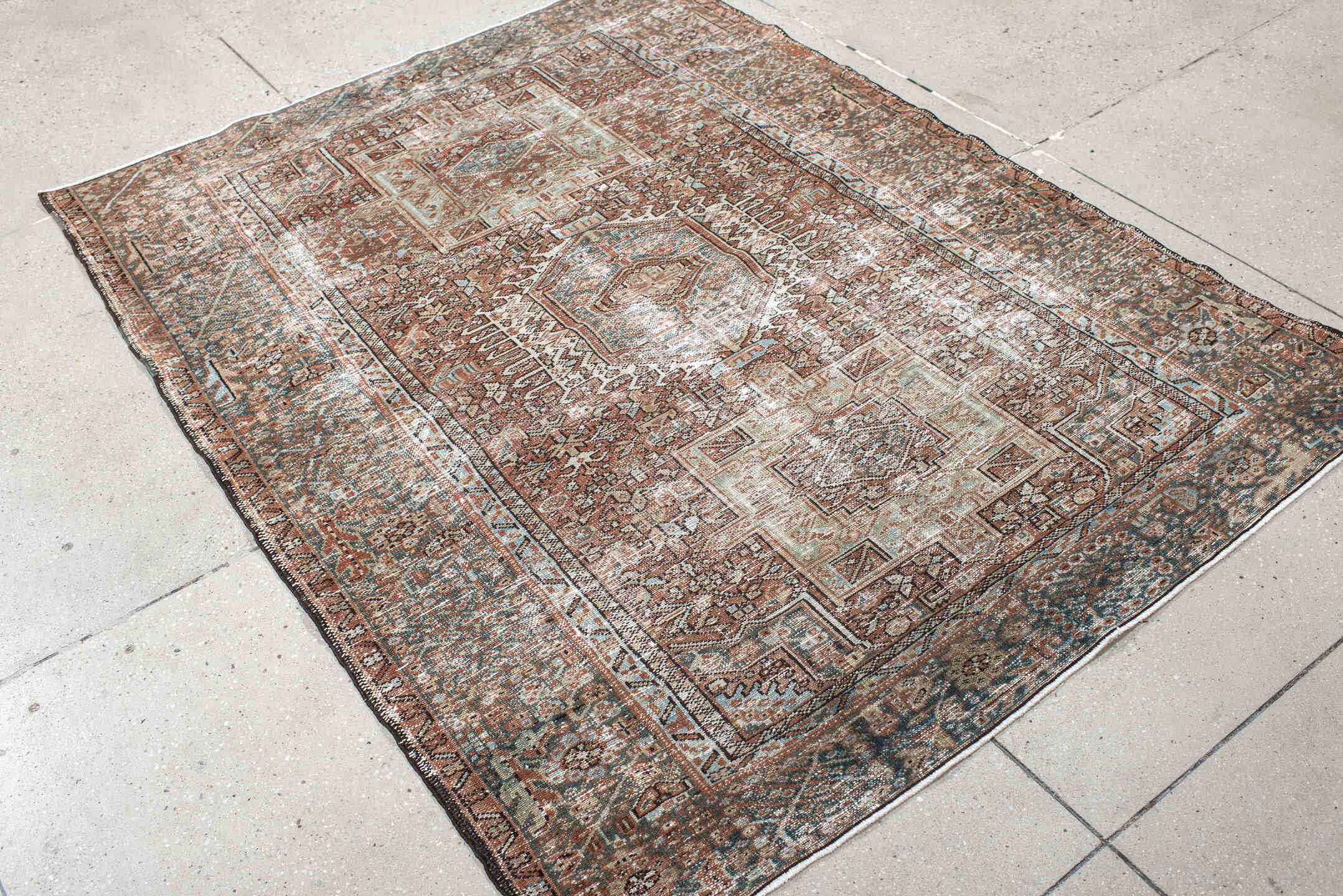 4' x 5' one-of-a-kind handmade antique Karaje small size rug. Color palette: rust, ivory, sage, charcoal, terra cotta, taupe