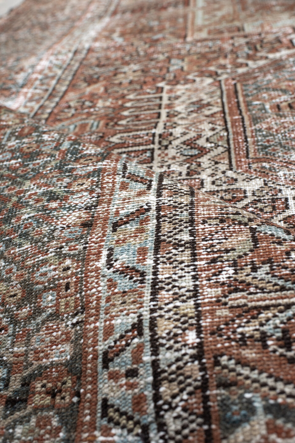 4' x 5' one-of-a-kind handmade antique Karaje small size rug. Color palette: rust, ivory, sage, charcoal, terra cotta, taupe