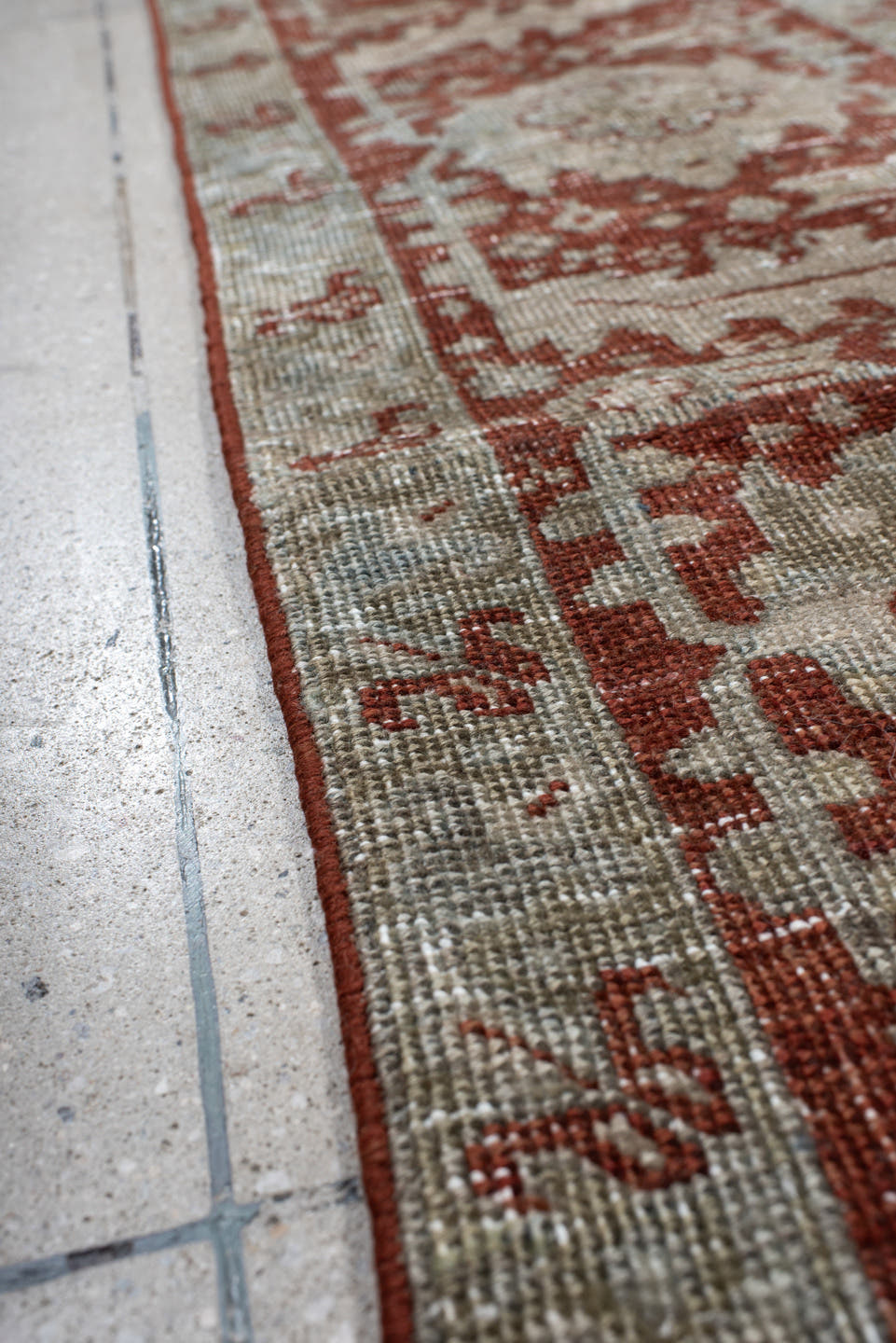 7' x 10' one-of-a-kind handmade antique Heriz large size rug. Color palette: rust, pale blue, ivory, brick, sage, taupe