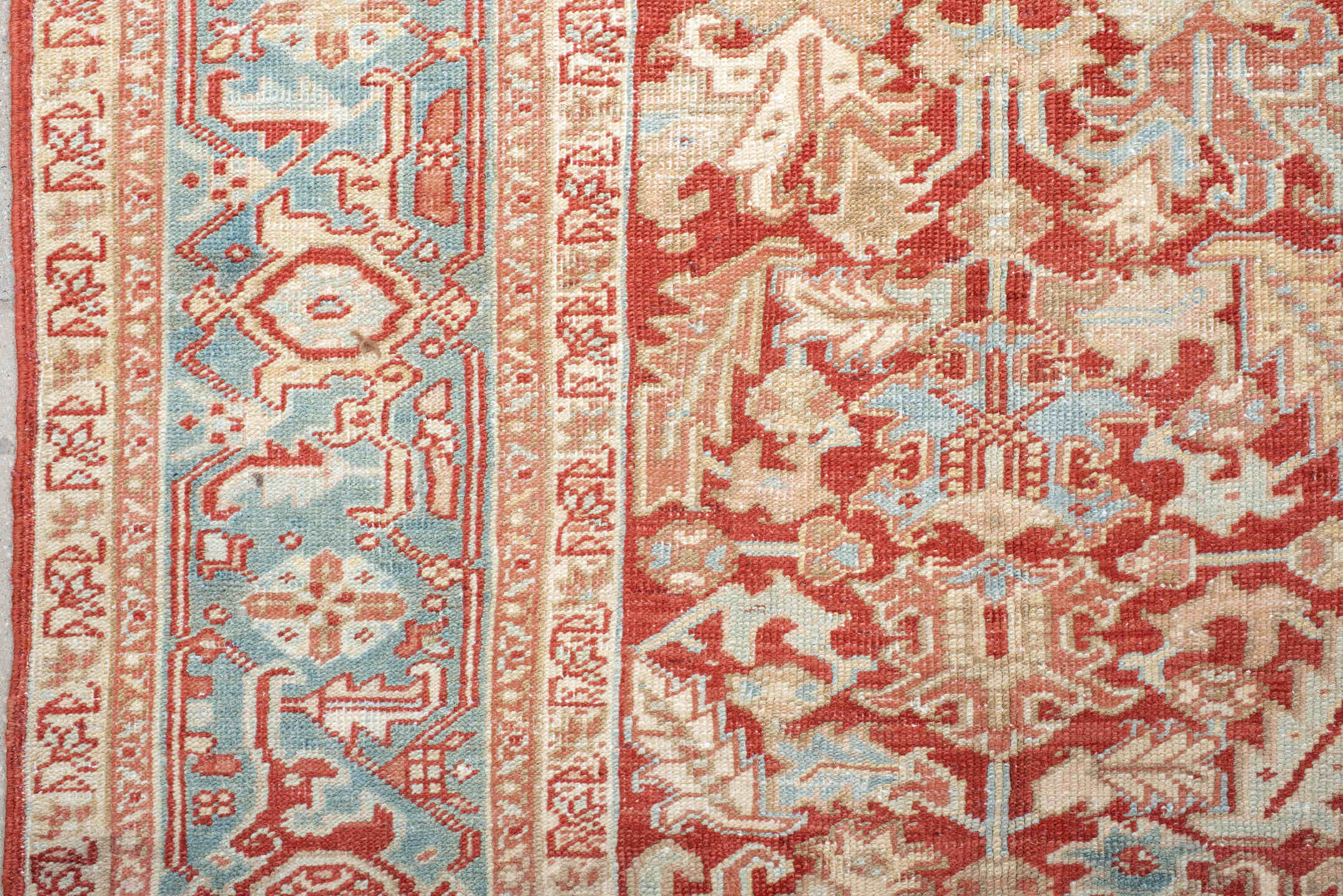 7' x 10' one-of-a-kind handmade antique Heriz large size rug. Color palette: rust, ivory, sky blue, coral, brick, cream