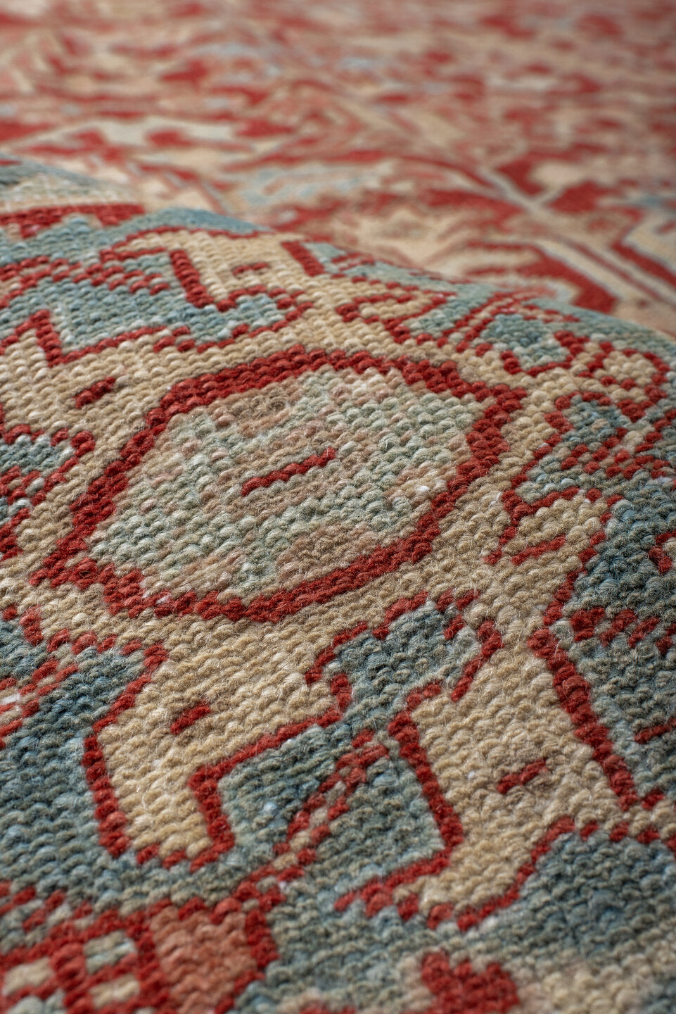 7' x 10' one-of-a-kind handmade antique Heriz large size rug. Color palette: rust, ivory, sky blue, coral, brick, cream
