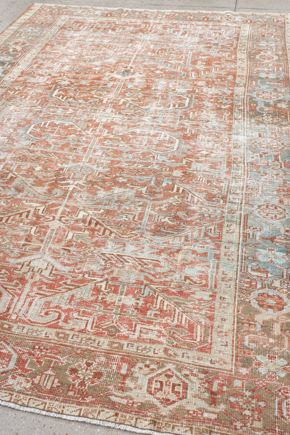7' x 10' one-of-a-kind handmade vintage Heriz large size rug. Color palette: ivory, terra cotta, pale blue, sage, taupe