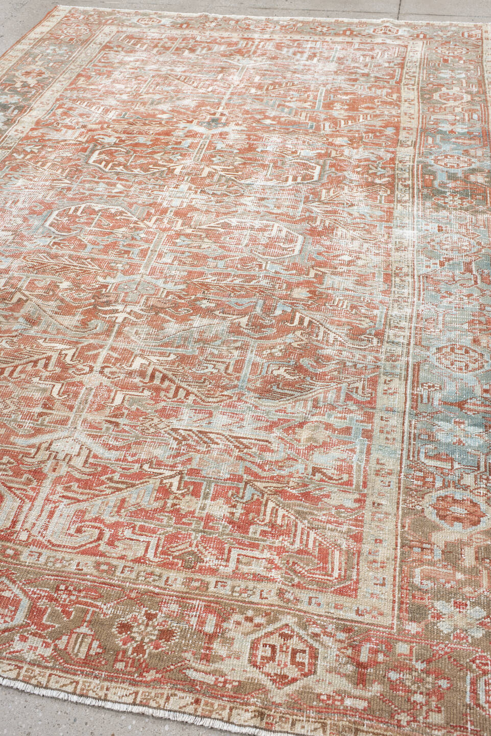 7' x 10' one-of-a-kind handmade vintage Heriz large size rug. Color palette: ivory, terra cotta, pale blue, sage, taupe