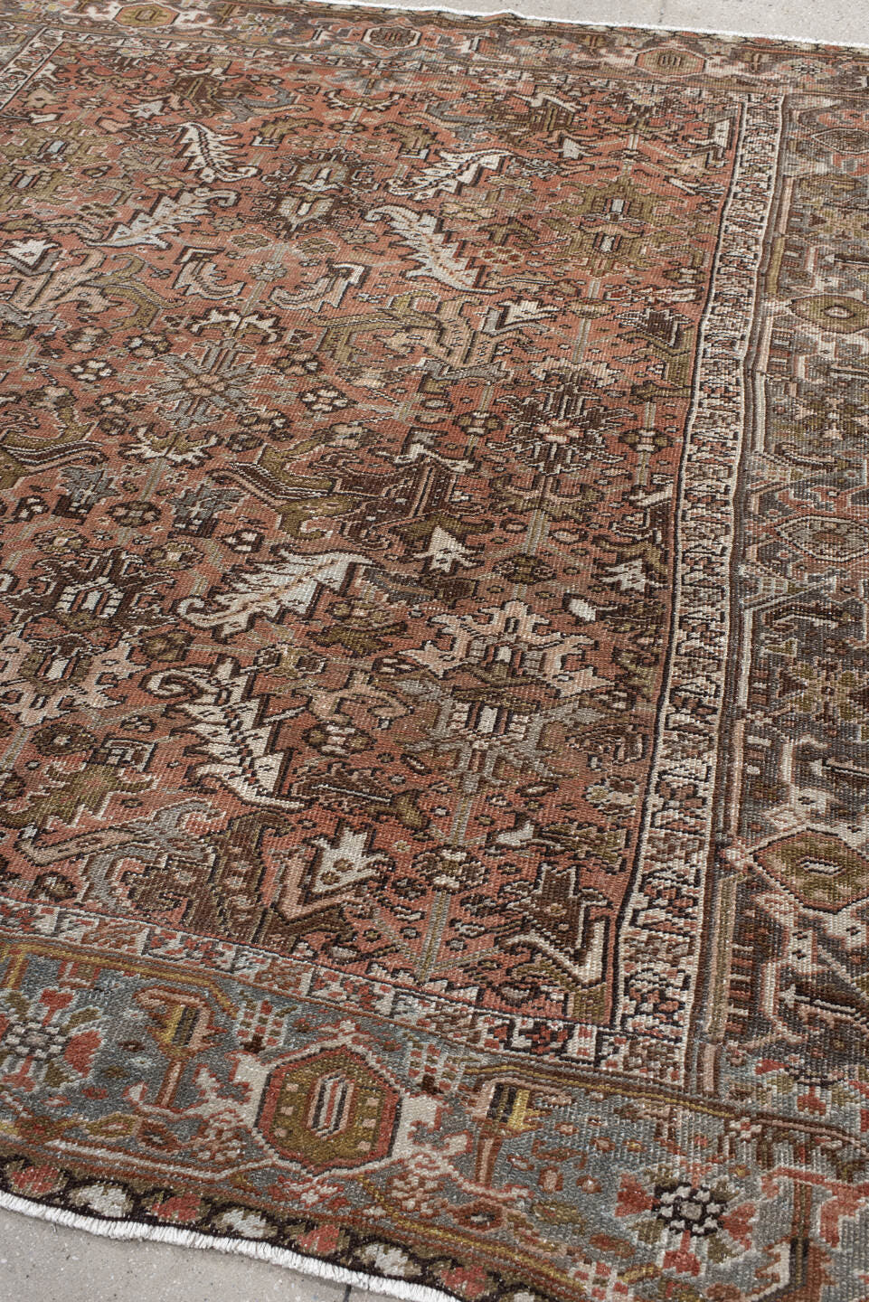 7' x 8' one-of-a-kind handmade antique Heriz rug. Color palette: terra cotta, slate, ivory, taupe, charcoal, olive, rust