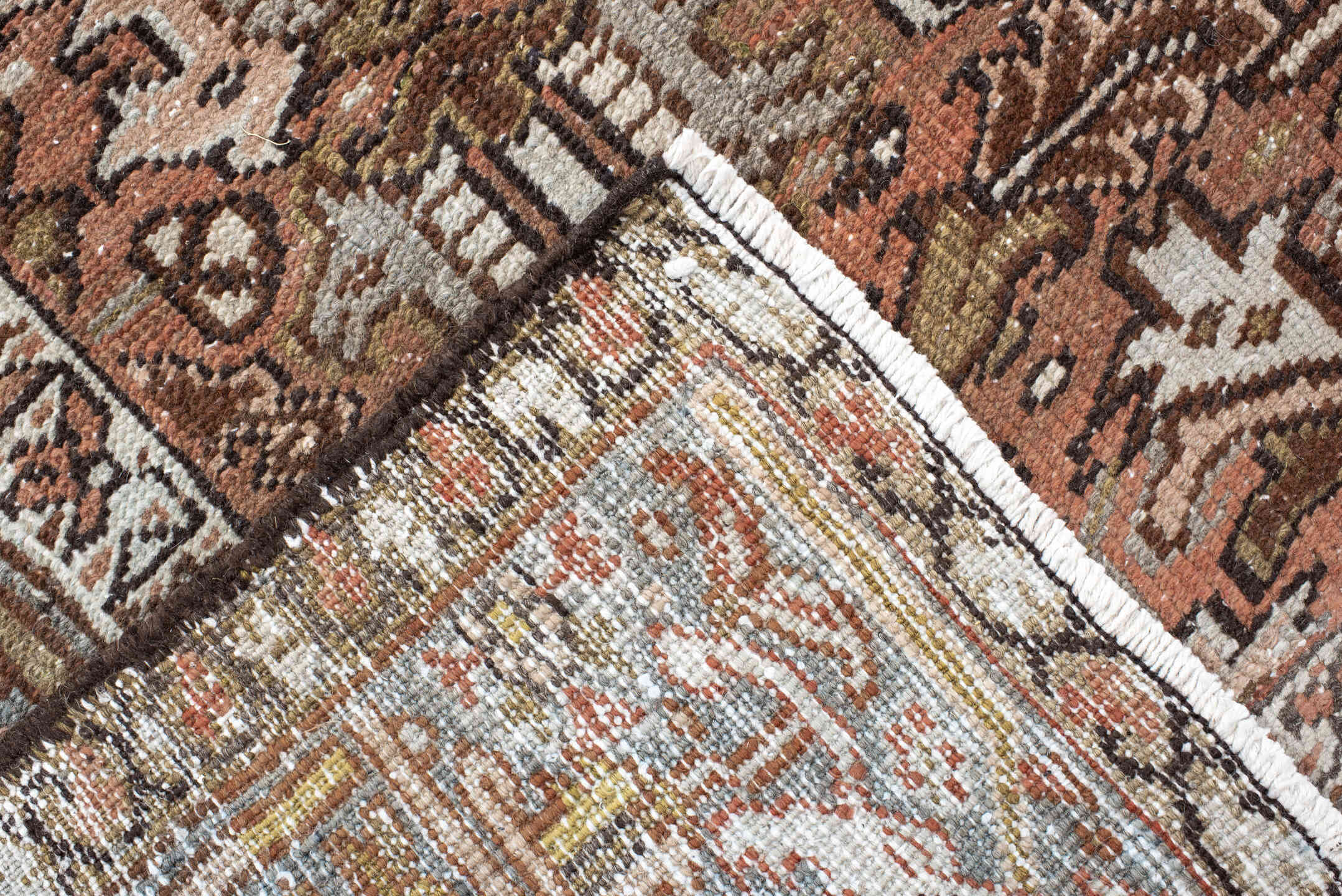 7' x 8' one-of-a-kind handmade antique Heriz rug. Color palette: terra cotta, slate, ivory, taupe, charcoal, olive, rust