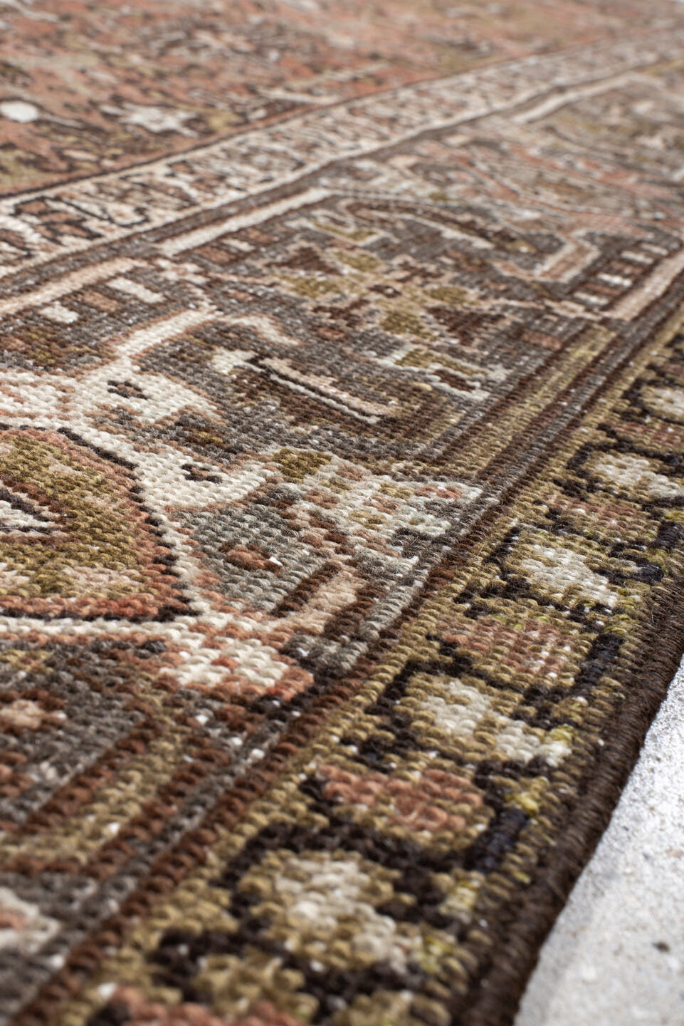 7' x 8' one-of-a-kind handmade antique Heriz rug. Color palette: terra cotta, slate, ivory, taupe, charcoal, olive, rust