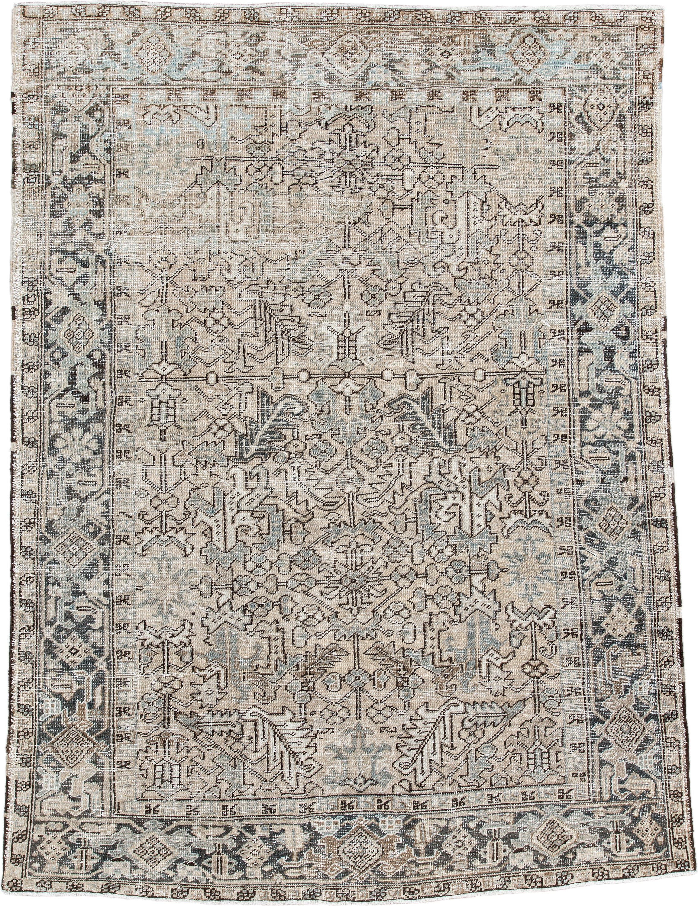 7' x 9' one-of-a-kind handmade antique Heriz rug. Color palette: ivory, taupe, slate, charcoal, camel, pale blue, brown
