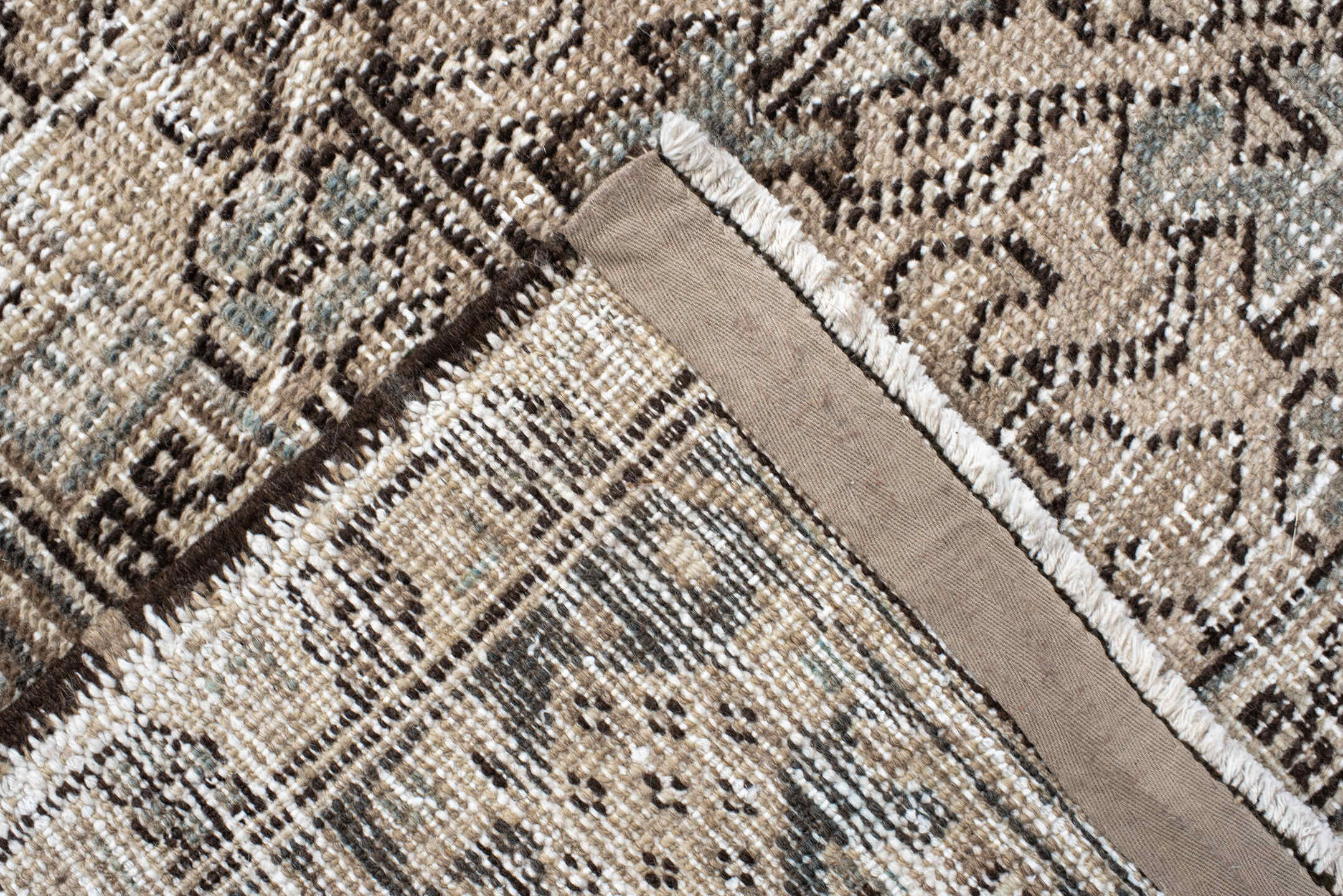 7' x 9' one-of-a-kind handmade antique Heriz rug. Color palette: ivory, taupe, slate, charcoal, camel, pale blue, brown
