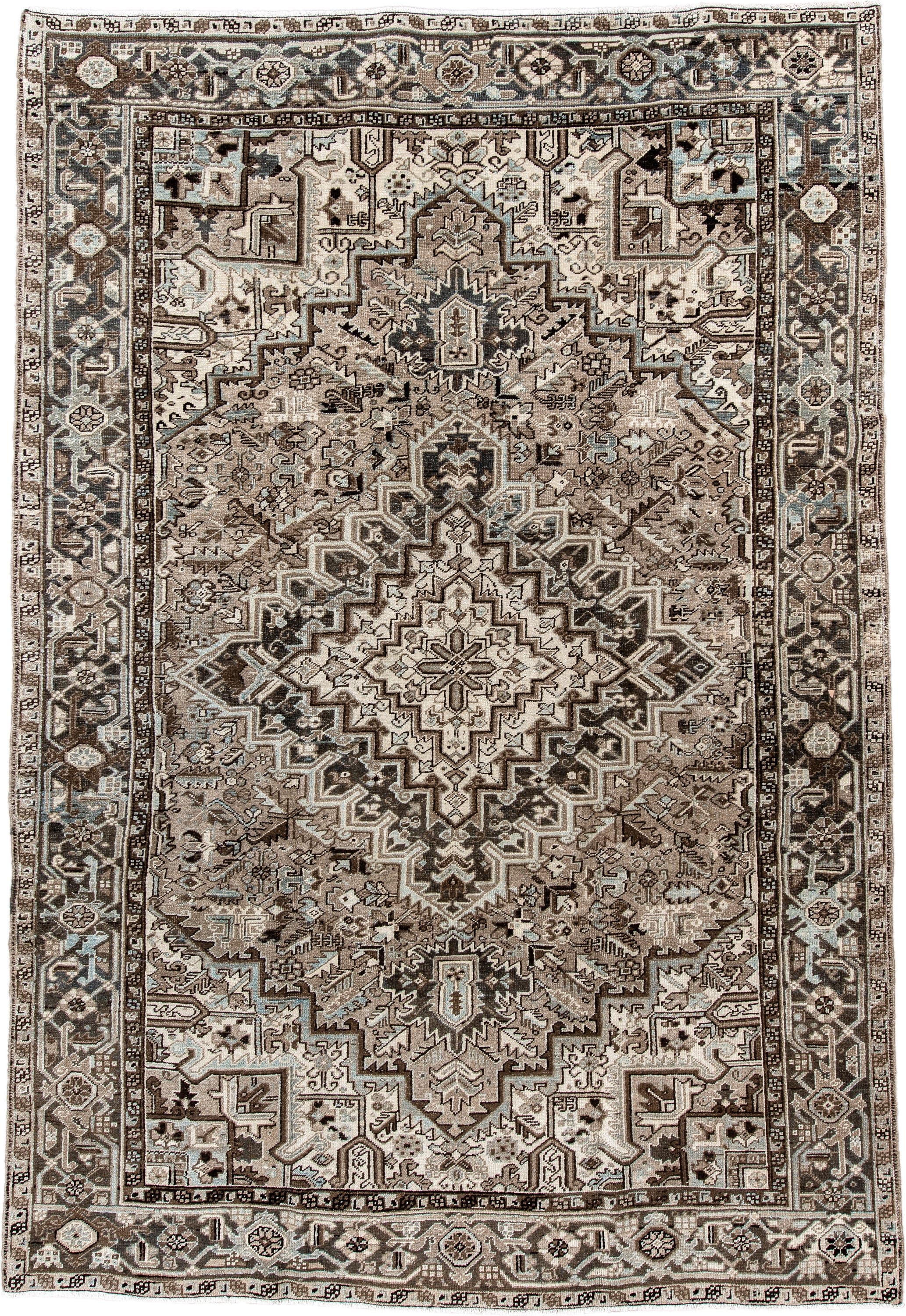 7' x 11' one-of-a-kind handmade antique Heriz large size rug. Color palette: taupe, brown, ivory, charcoal, pale blue, camel