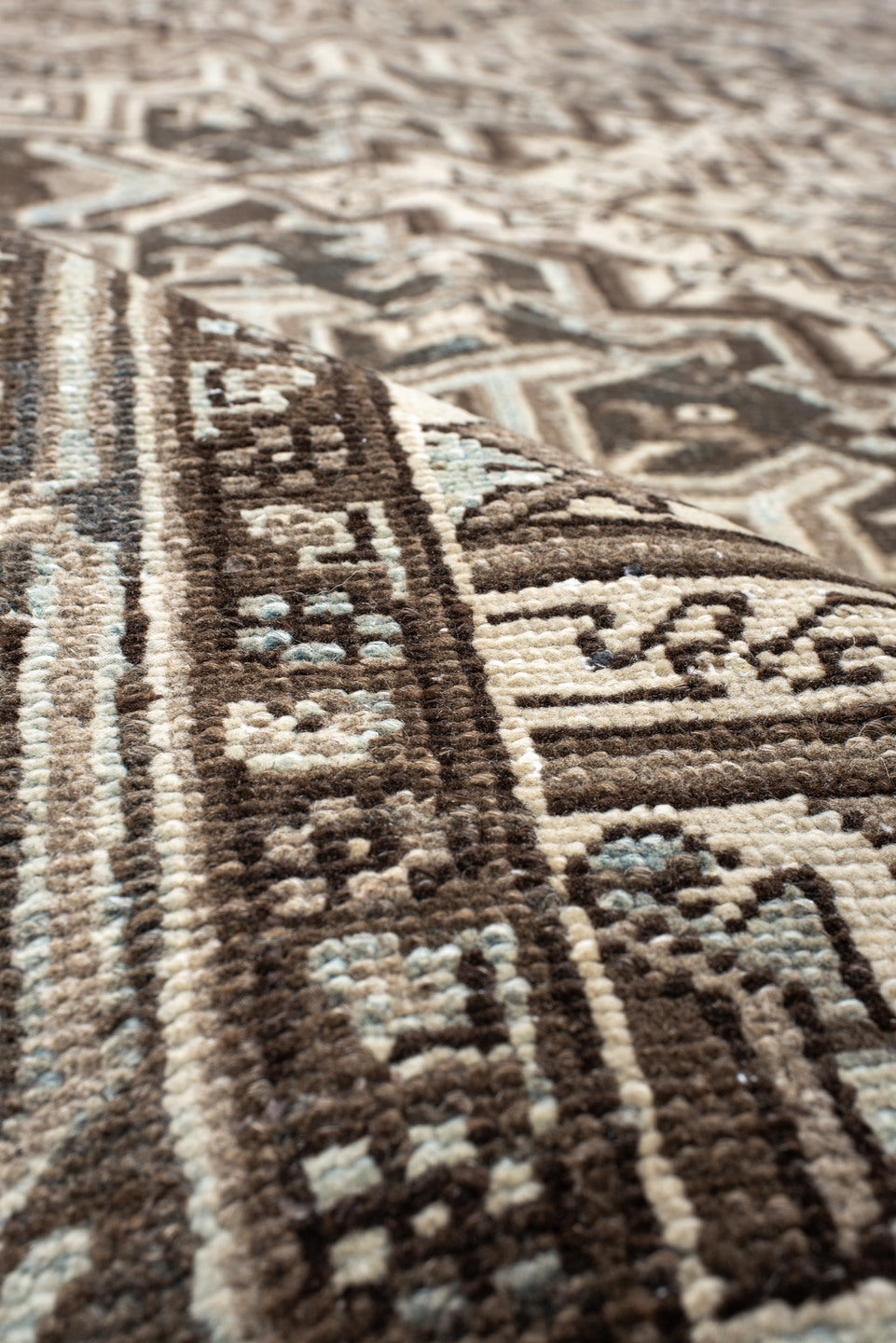 7' x 11' one-of-a-kind handmade antique Heriz large size rug. Color palette: taupe, brown, ivory, charcoal, pale blue, camel