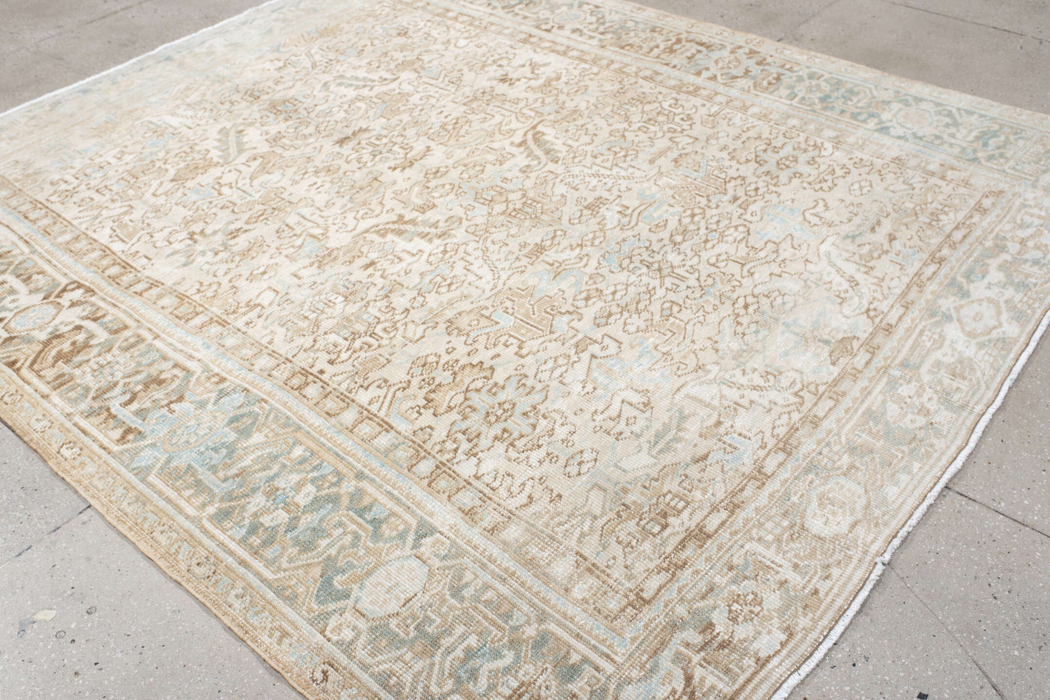 7' x 8' one-of-a-kind handmade antique Heriz rug. Color palette: ivory, taupe, pale blue, sand, beige, camel, gray