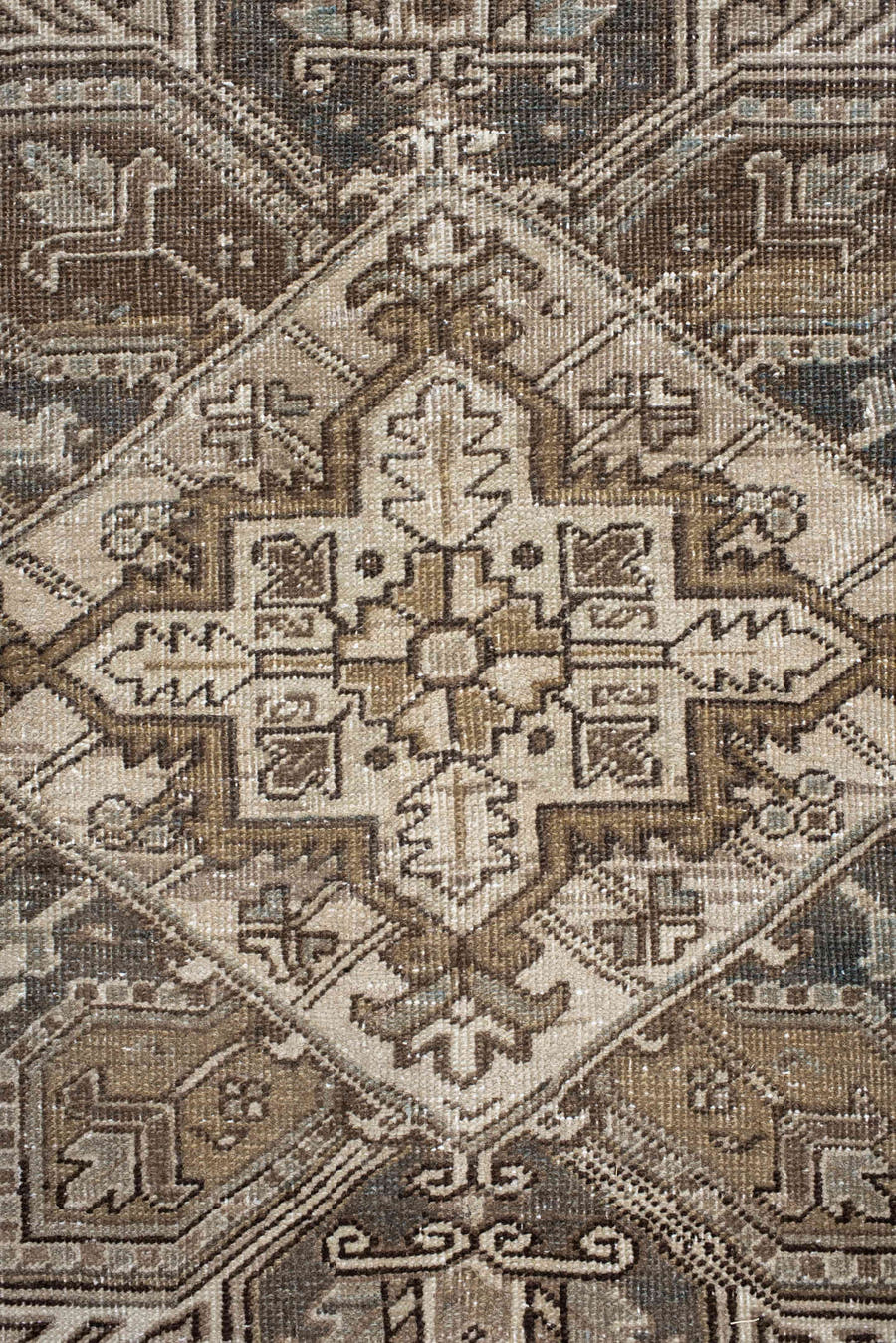 6' x 9' one-of-a-kind handmade antique Heriz rug. Color palette: ivory, taupe, camel, charcoal, brown, sage, beige, gray
