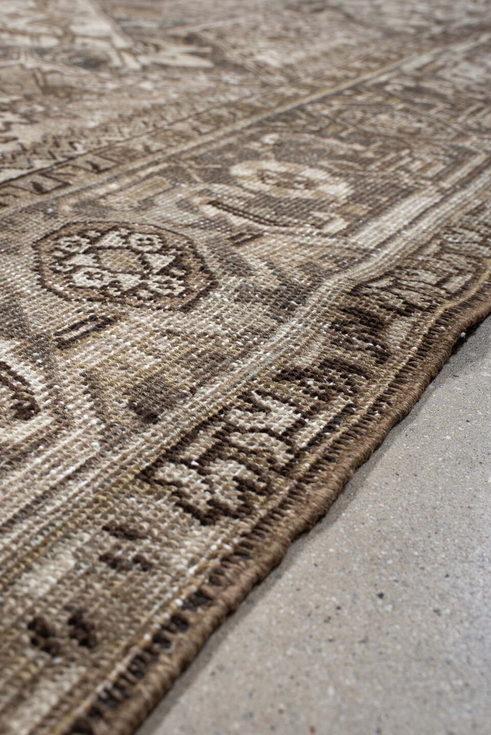 6' x 9' one-of-a-kind handmade antique Heriz rug. Color palette: ivory, taupe, camel, charcoal, brown, sage, beige, gray