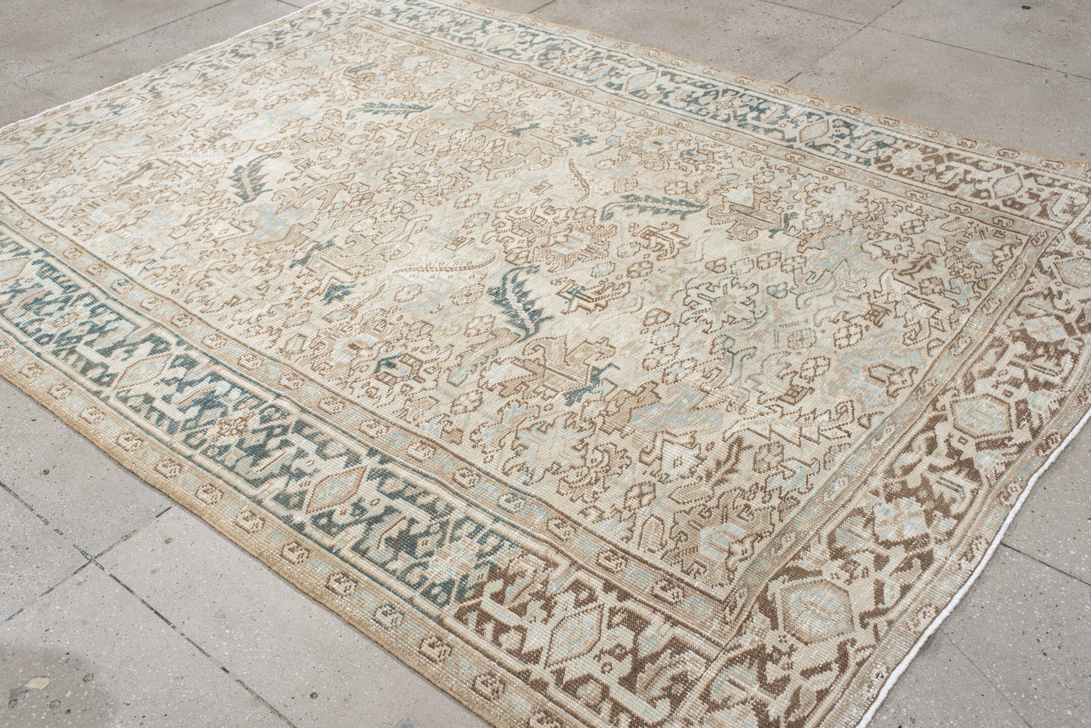 6' x 9' one-of-a-kind handmade antique Heriz medium size rug. Color palette: ivory, taupe, camel, sage, light blue, beige