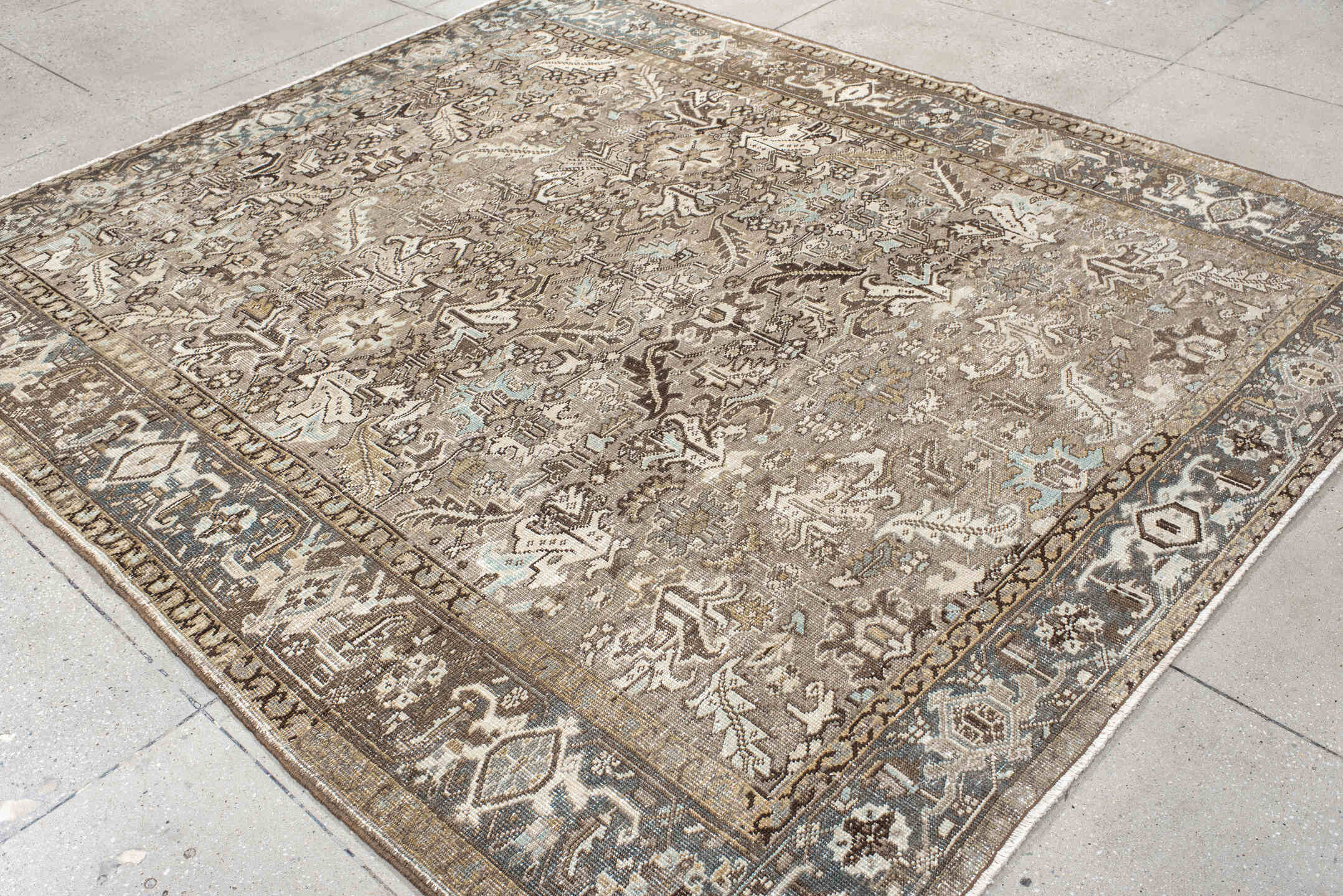7' x 8' one-of-a-kind handmade antique Heriz rug. Color palette: taupe, brown, ivory, powder_blue, beige, charcoal, gray