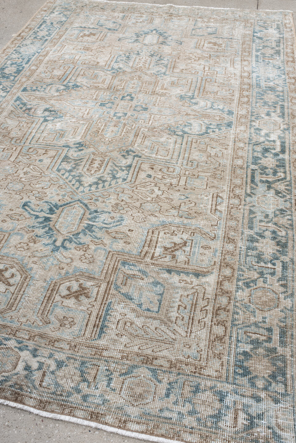 6' x 9' one-of-a-kind handmade antique Heriz medium size rug. Color palette: ivory, taupe, pale blue, beige, slate, cream