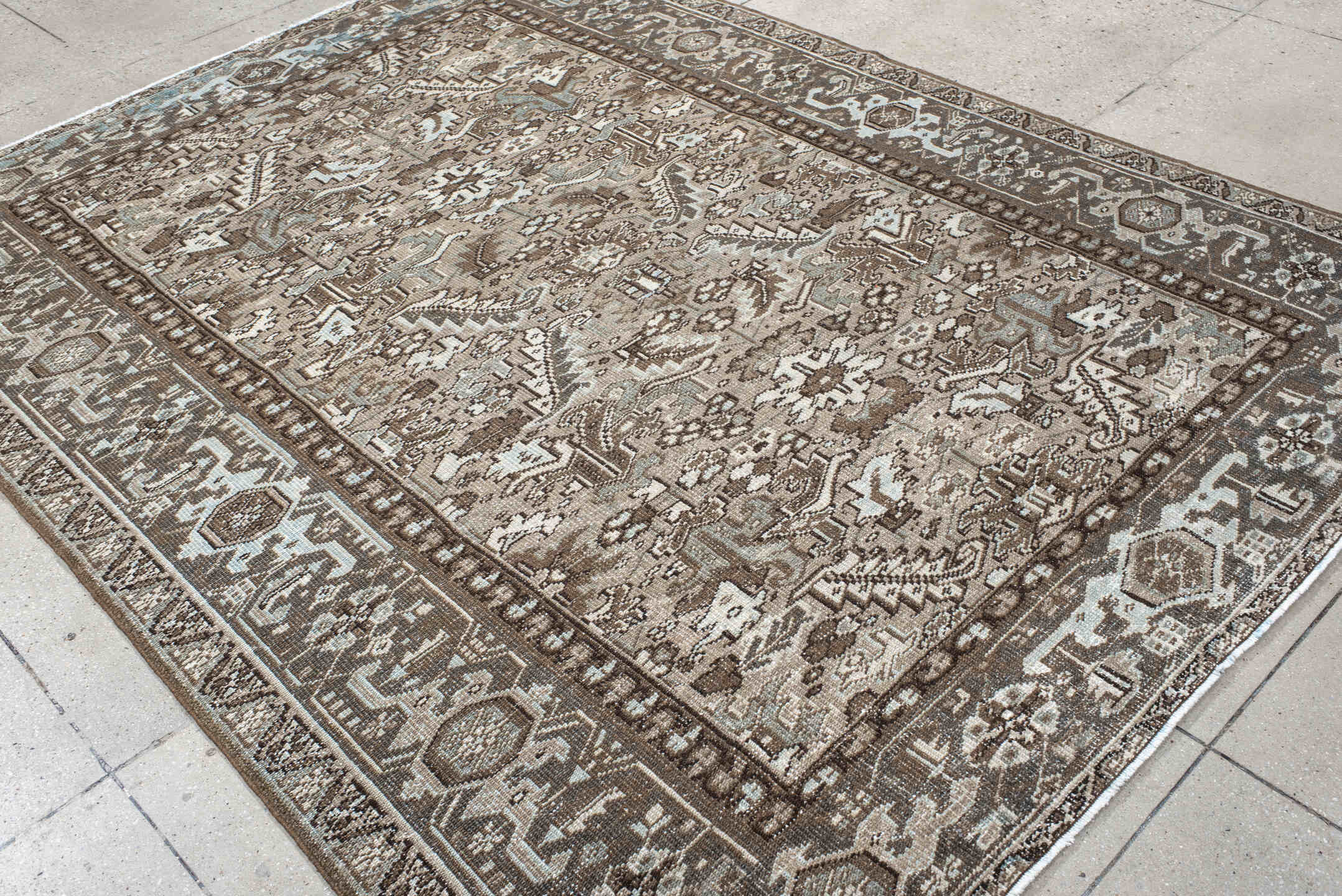 6' x 8' one-of-a-kind handmade vintage Heriz medium size rug. Color palette: black, brown, charcoal, dark gray, floral white