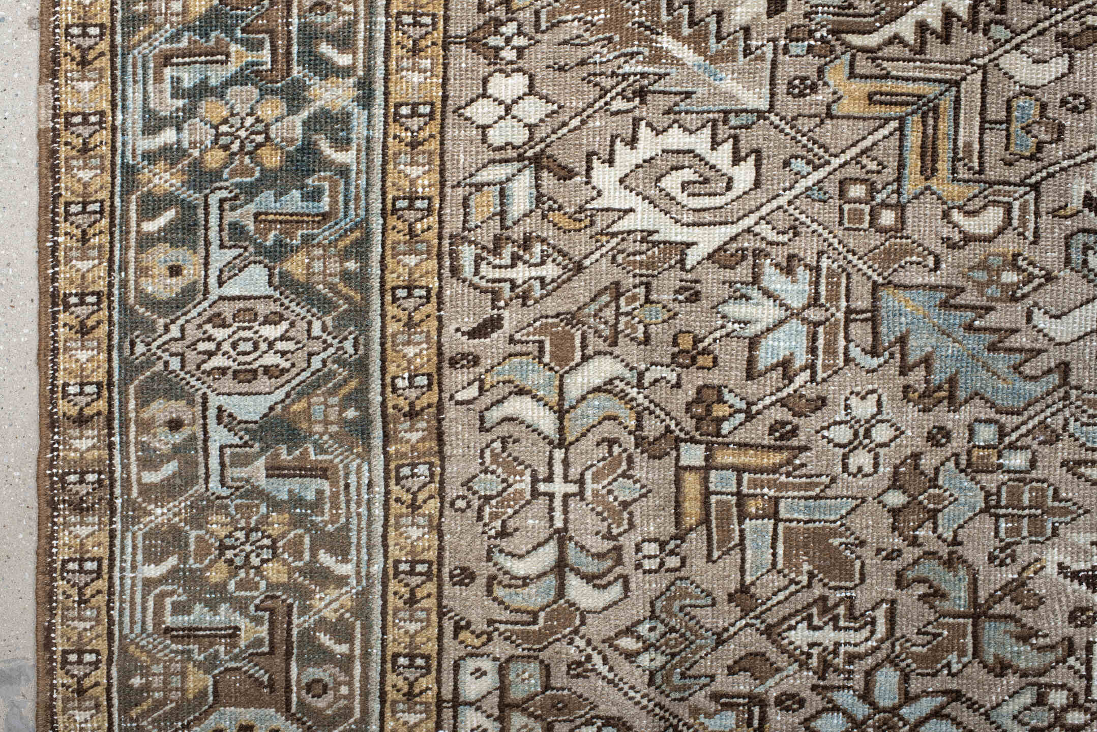 7' x 10' one-of-a-kind handmade antique Heriz large size rug. Color palette: taupe, ivory, slate, camel, brown, pale blue
