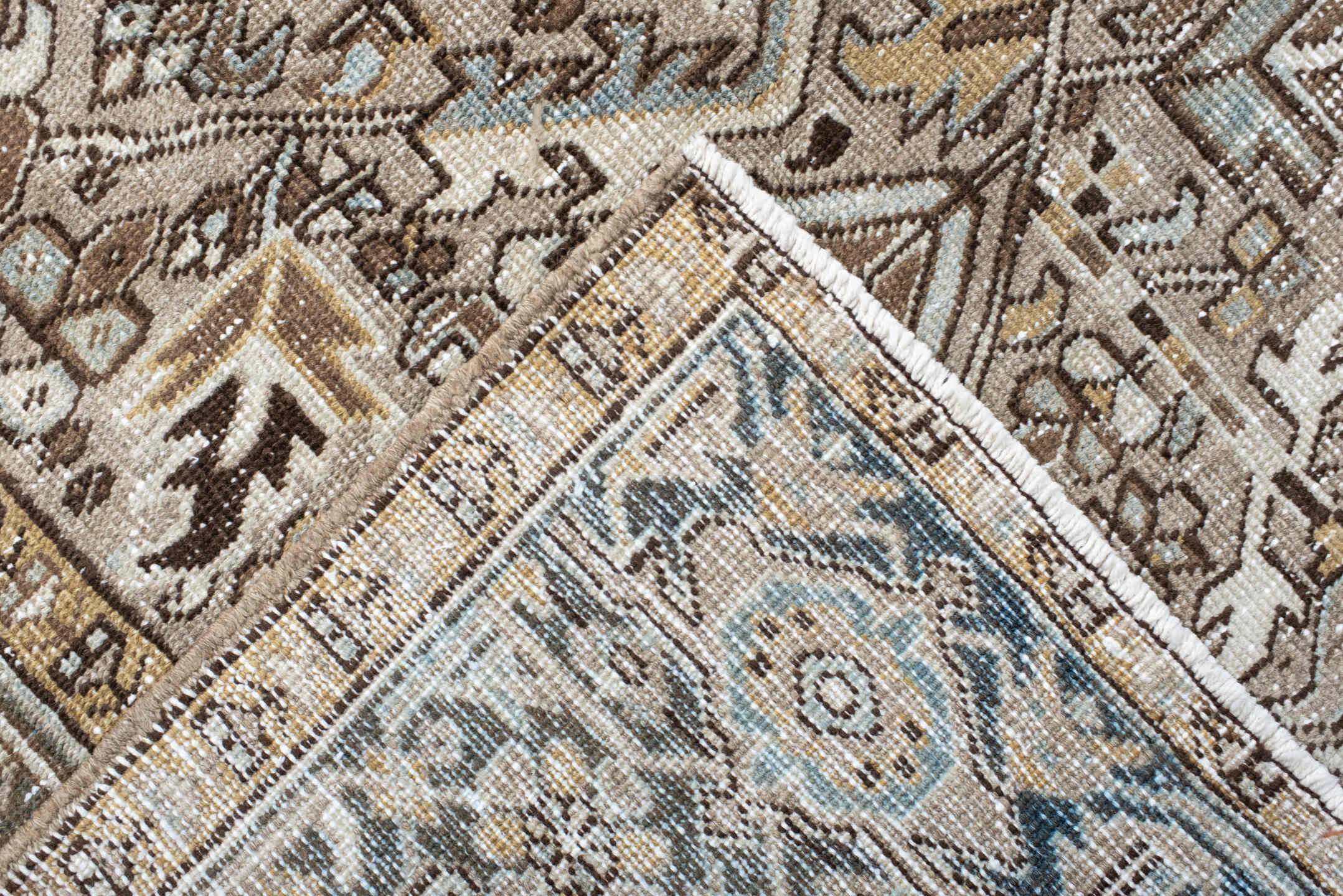 7' x 10' one-of-a-kind handmade antique Heriz large size rug. Color palette: taupe, ivory, slate, camel, brown, pale blue