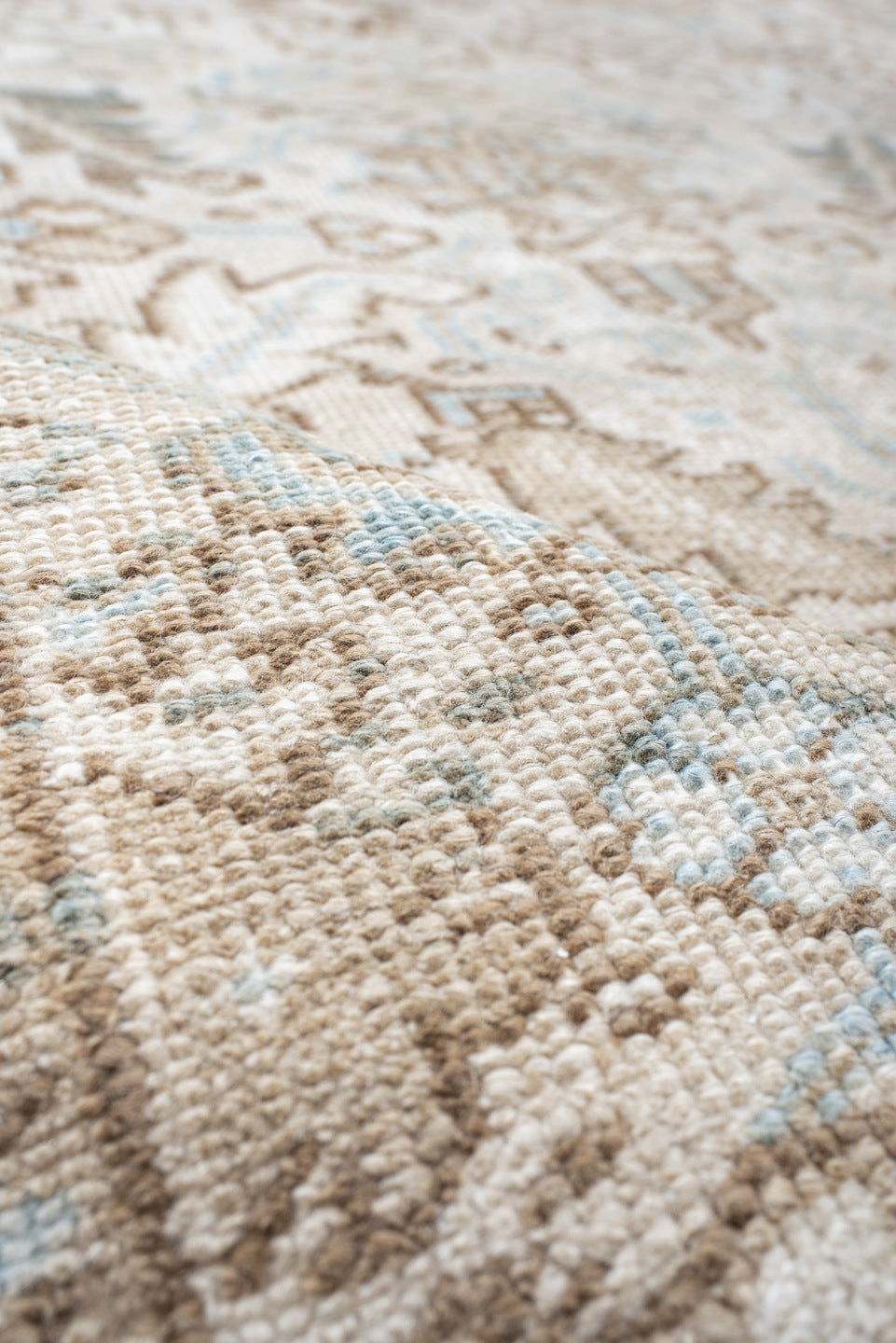 7' x 8' one-of-a-kind handmade antique Heriz rug. Color palette: ivory, camel, pale blue, taupe, light gray, sand, beige